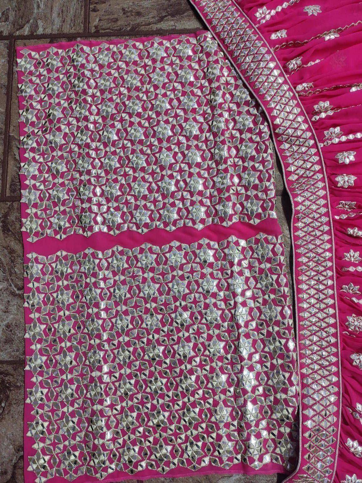 Pink ethnic lehenga with mirror work and silver embroidery, perfect for Indian weddings and festive occasions.