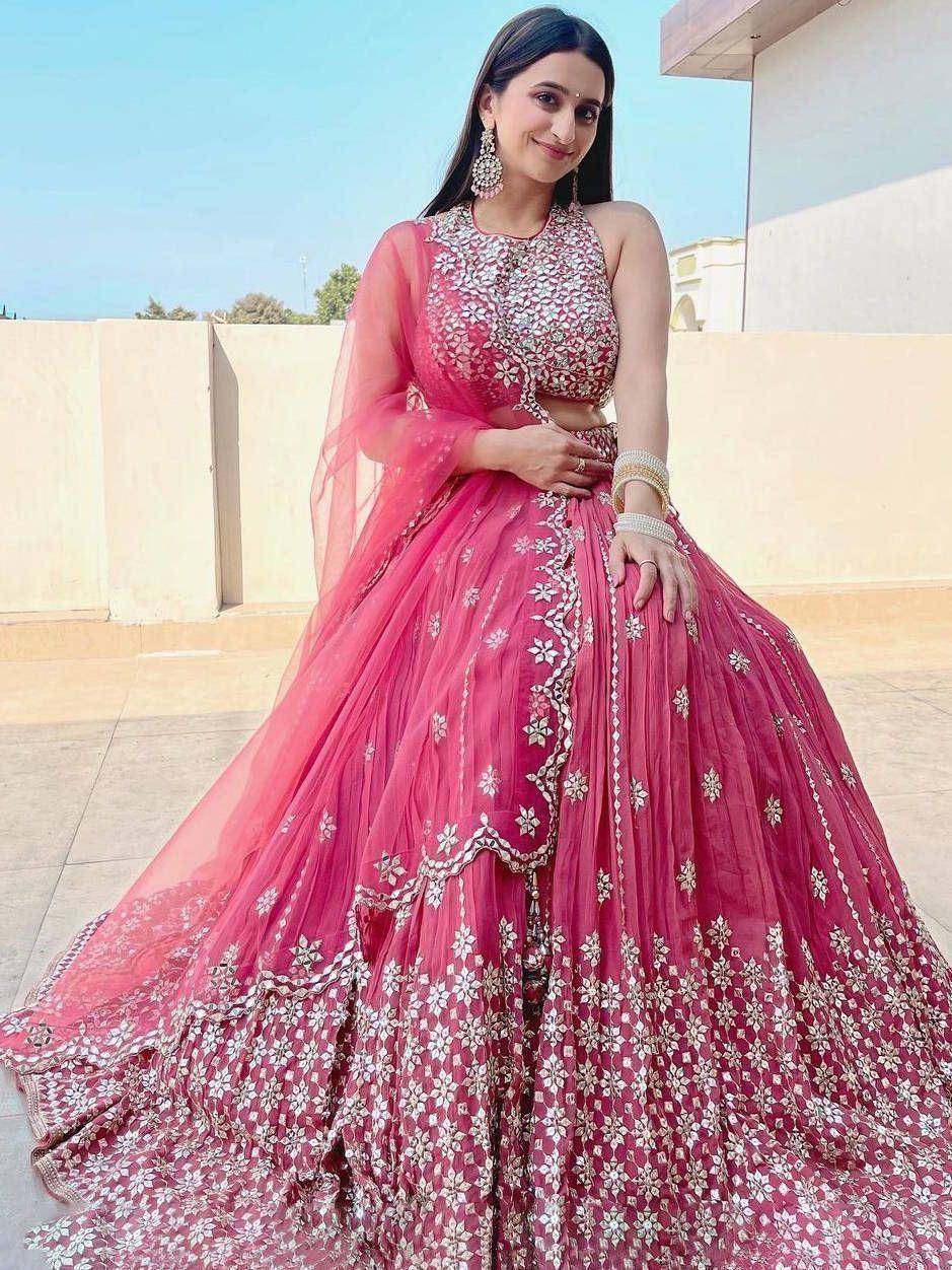 Pink floral embroidered lehenga choli with sheer dupatta, perfect for Indian weddings and festive occasions