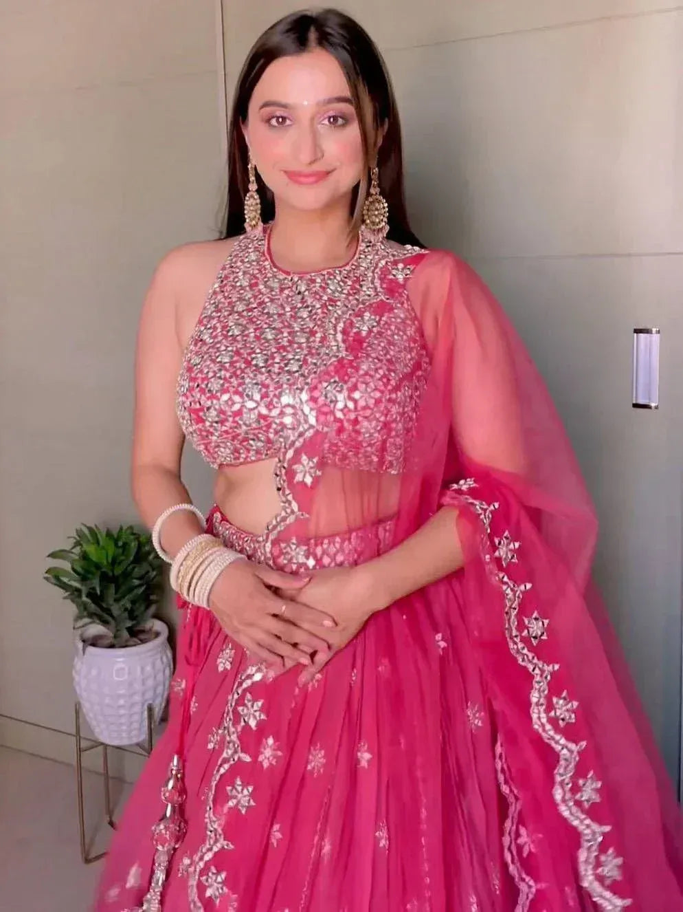 Red velvet embroidered lehenga choli with pink net skirt, perfect for Indian weddings and festive occasions