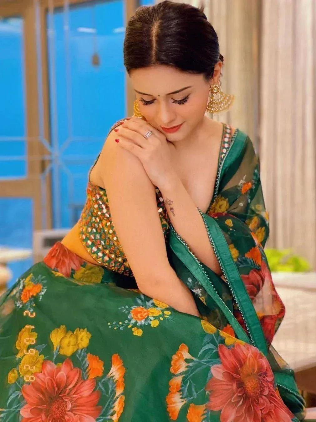 Woman in green floral lehenga choli with sequin blouse, ethnic Indian wear