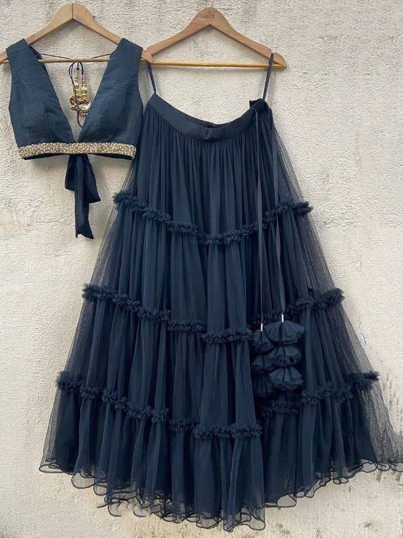 Dark blue tiered tulle lehenga with embellished crop top, perfect for ethnic occasions