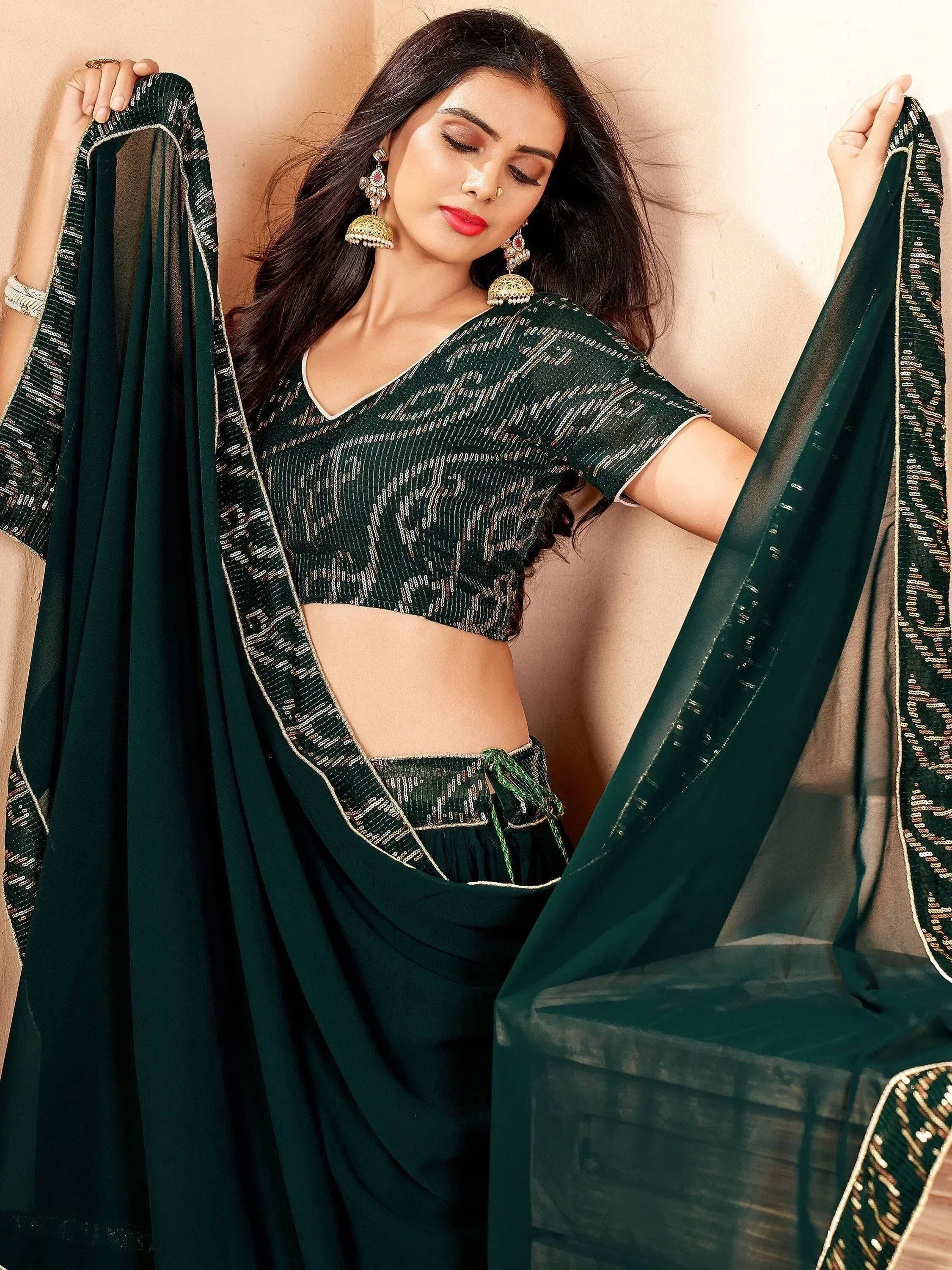 Emerald green designer saree with sequin blouse and matching palazzo, perfect for Indian ethnic wear occasions.