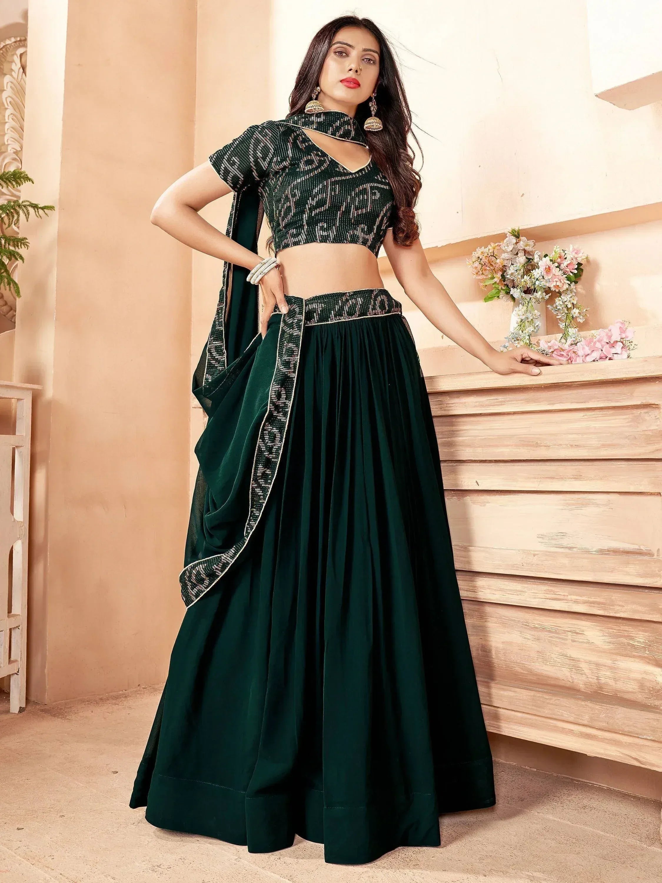 Emerald green designer lehenga choli with sequin blouse and pleated skirt, perfect for Indian ethnic occasions