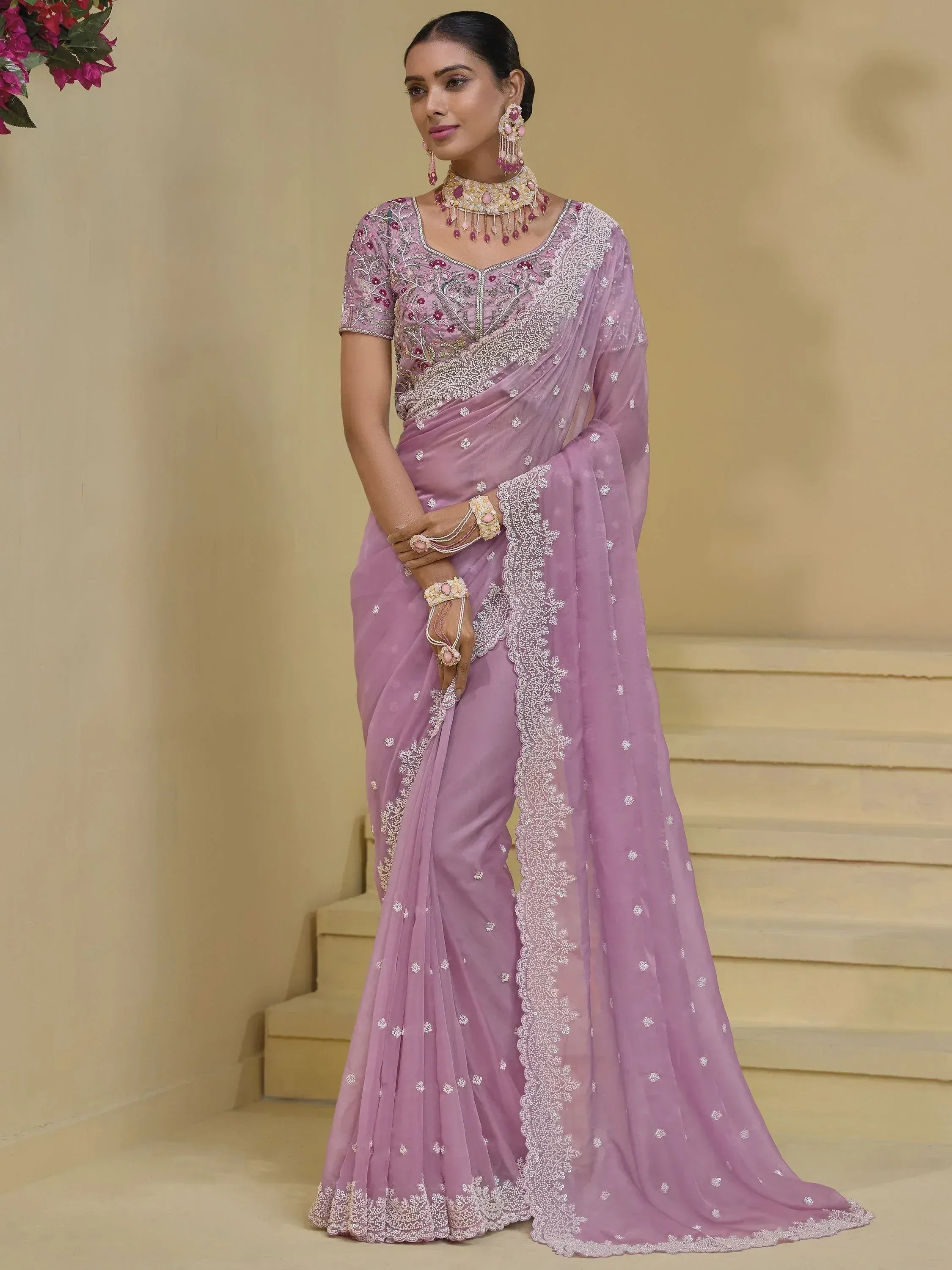 Elegant lavender saree with intricate embroidery and embellished blouse, perfect for Indian ethnic occasions.