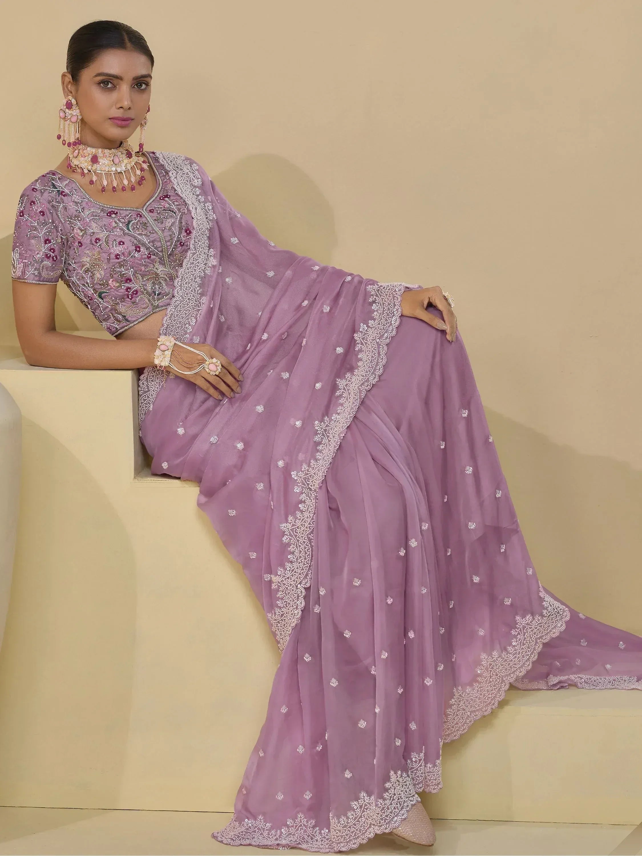 Lavender designer lehenga choli with intricate embroidery and sequin work, perfect for Indian ethnic wear.