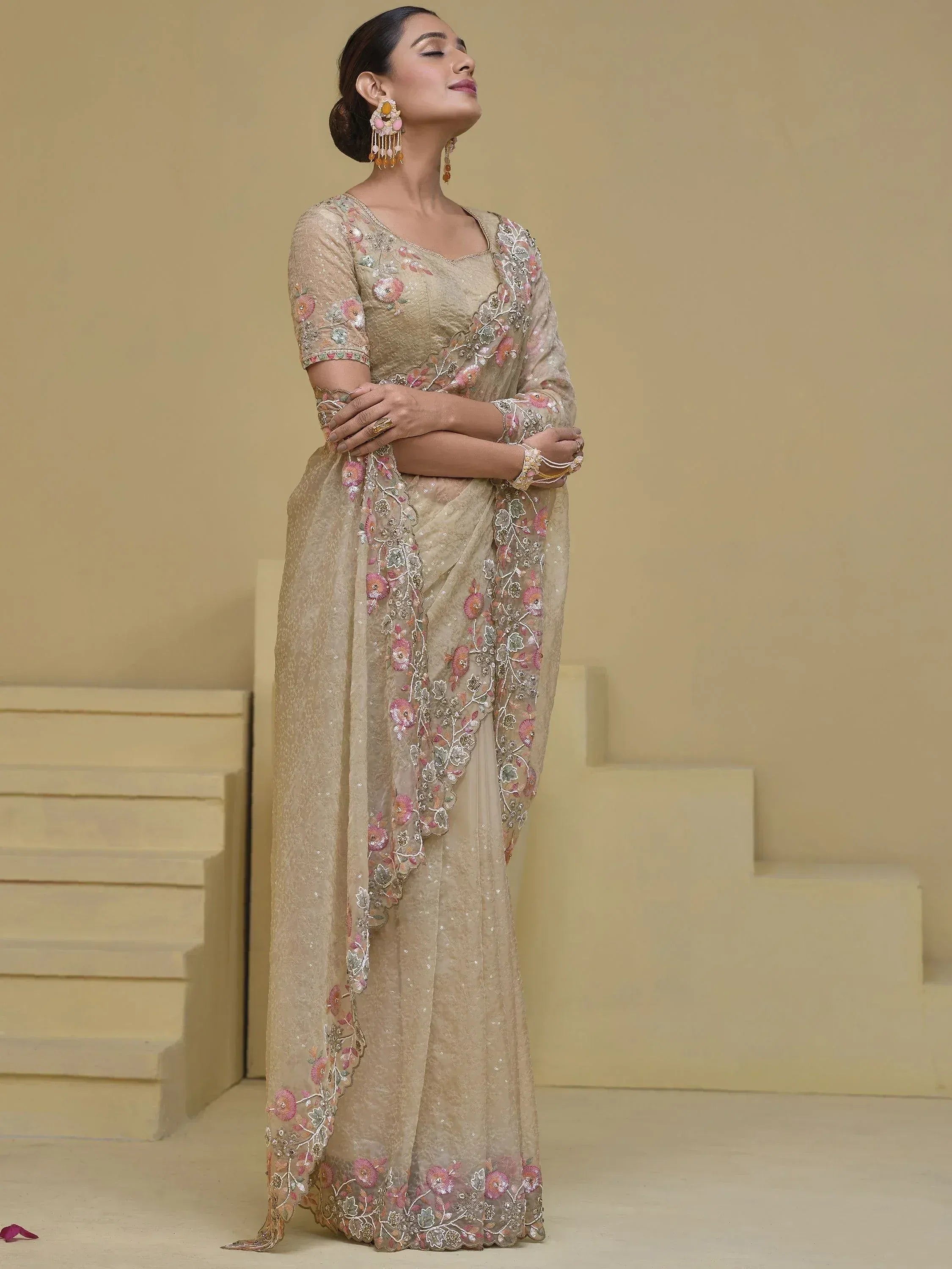 Beige floral embroidered saree with sequins, perfect for Indian ethnic wear and festive occasions.