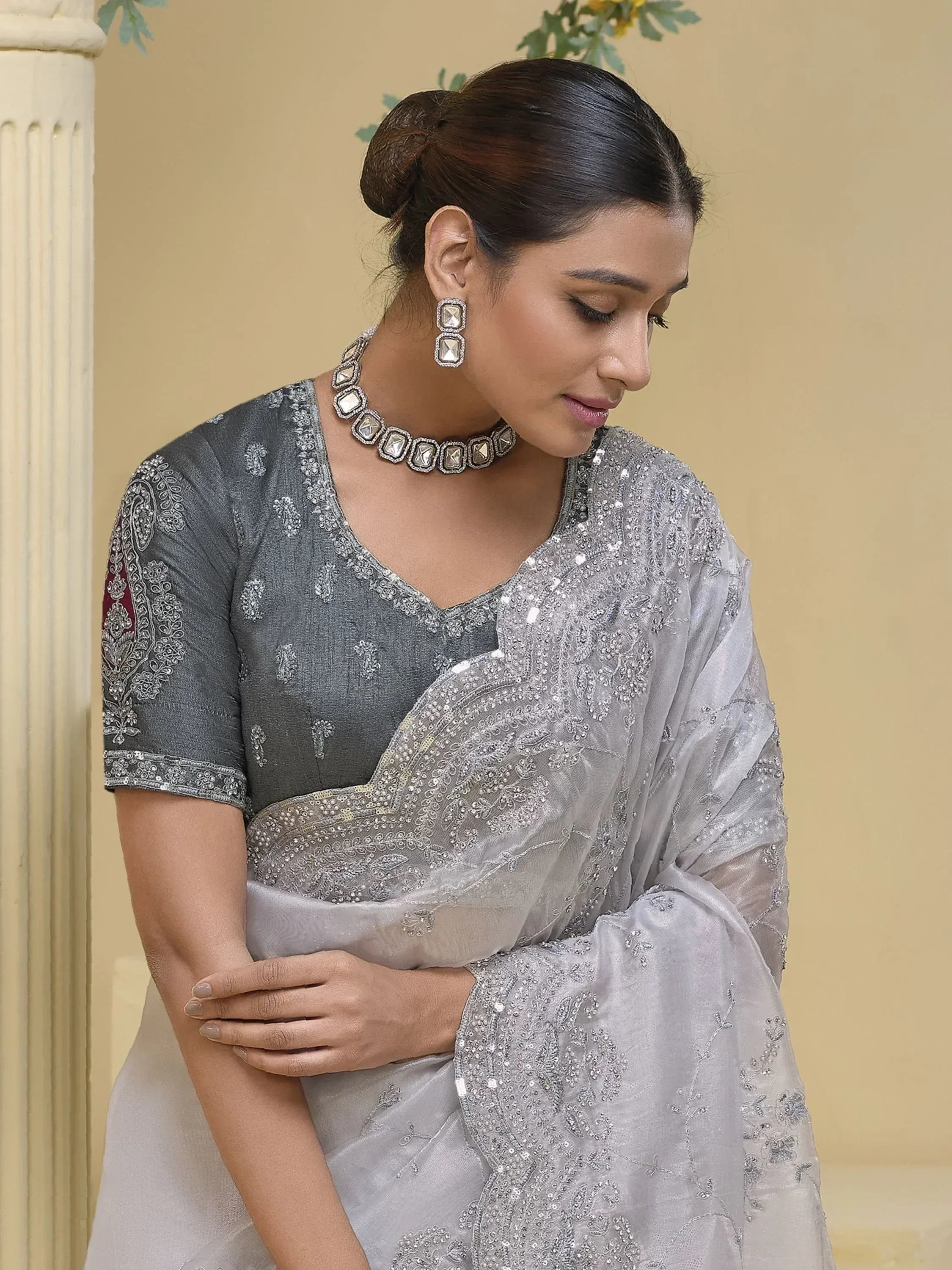 Elegant grey embroidered saree with matching blouse, perfect for Indian ethnic wear occasions.