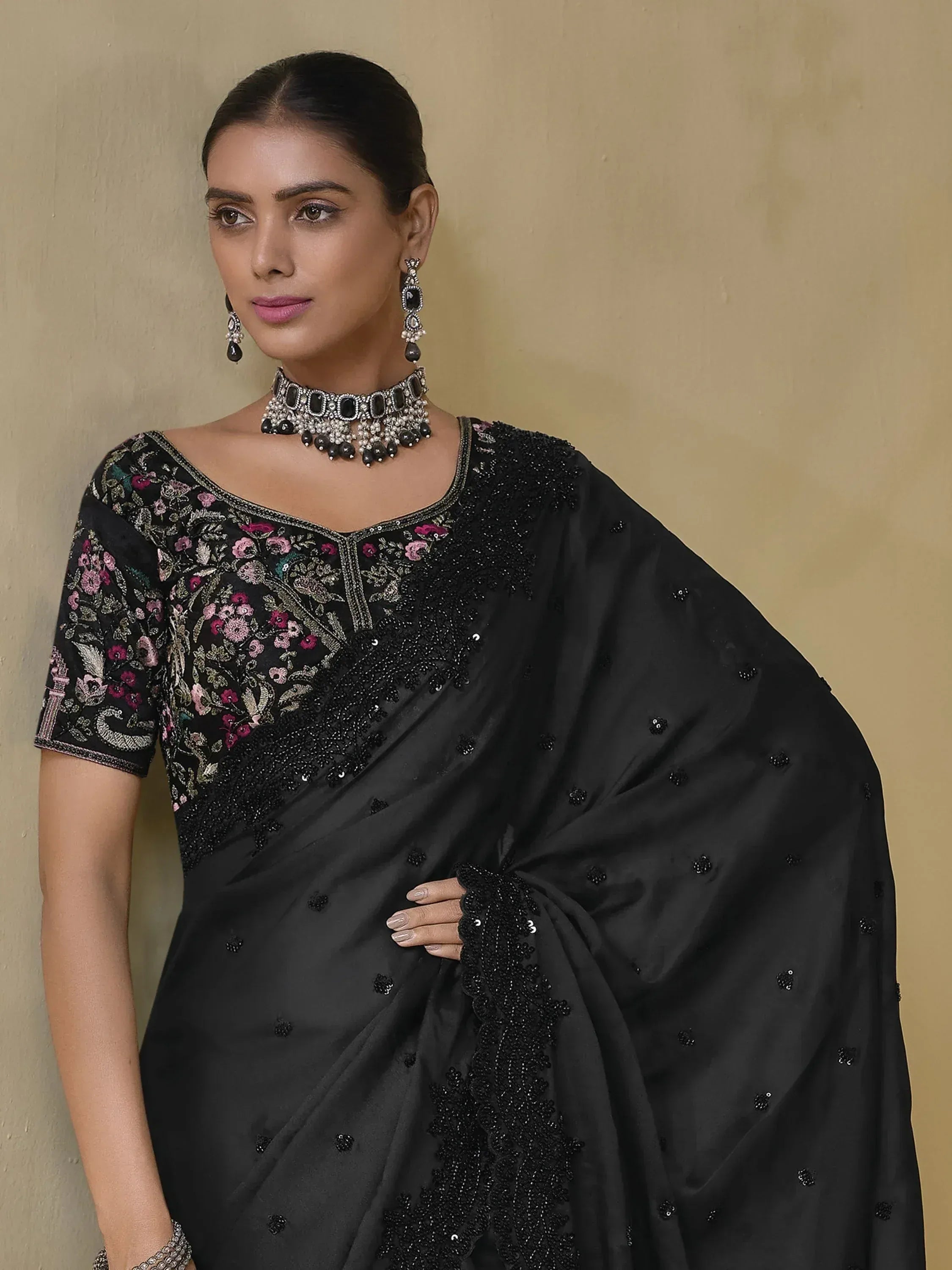 Black embroidered saree with floral blouse, perfect for Indian ethnic wear occasions
