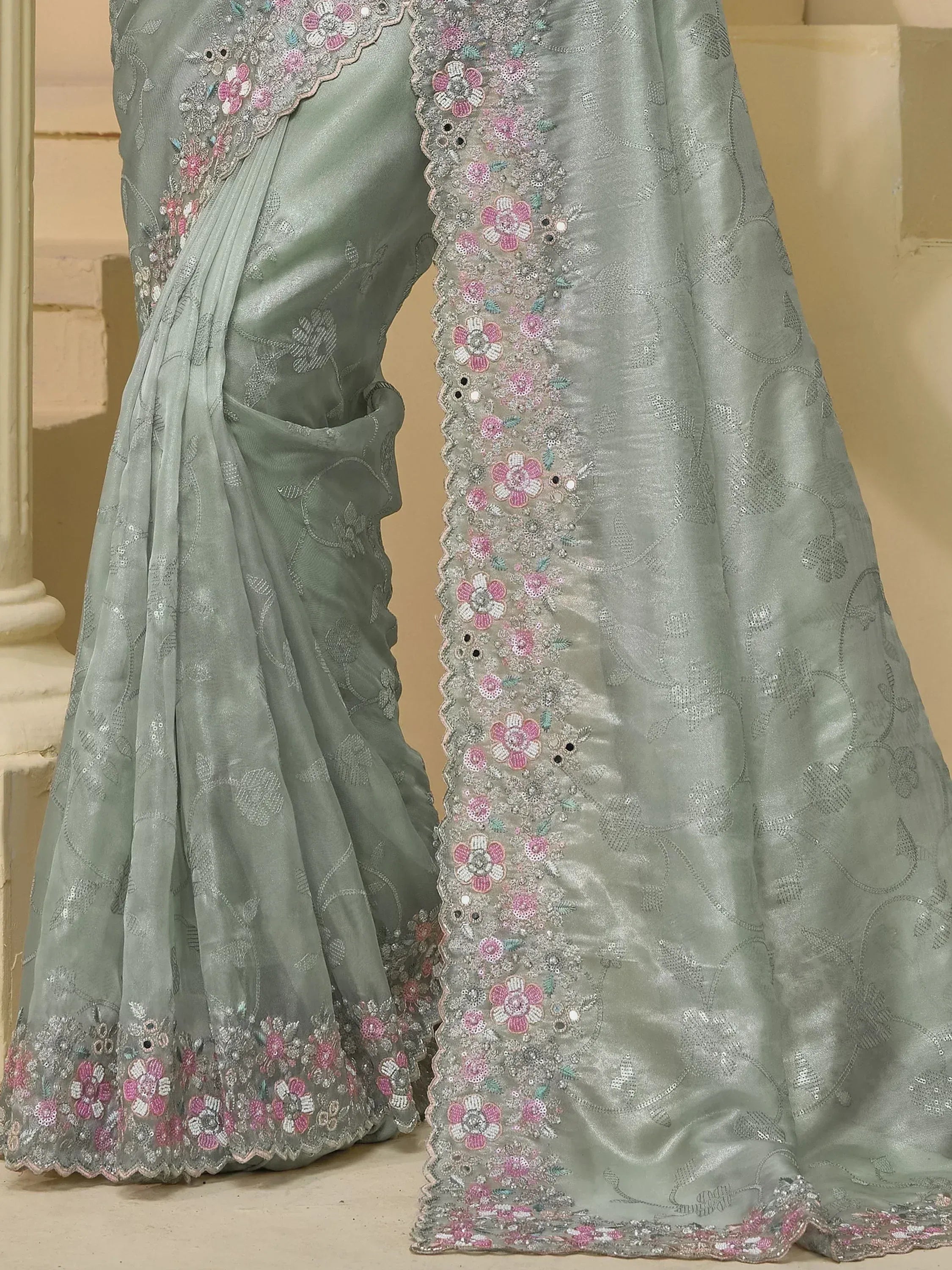 Light green saree with pink floral embroidery and sequin detailing, elegant Indian ethnic wear