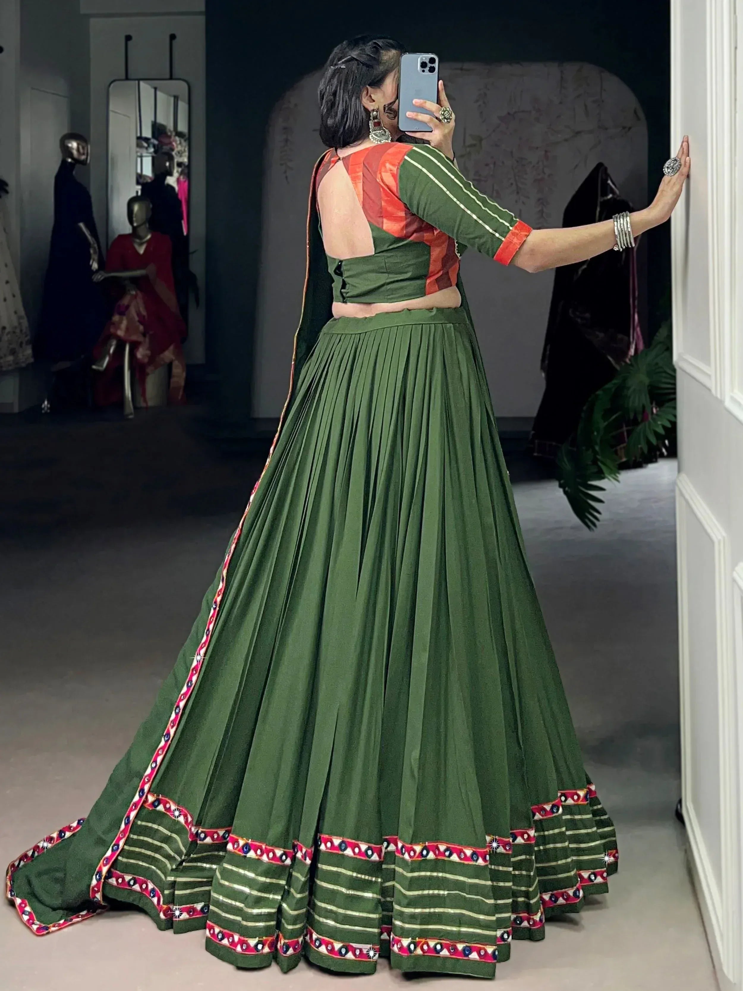 Green pleated lehenga choli with red border, backless blouse, ethnic wear for women