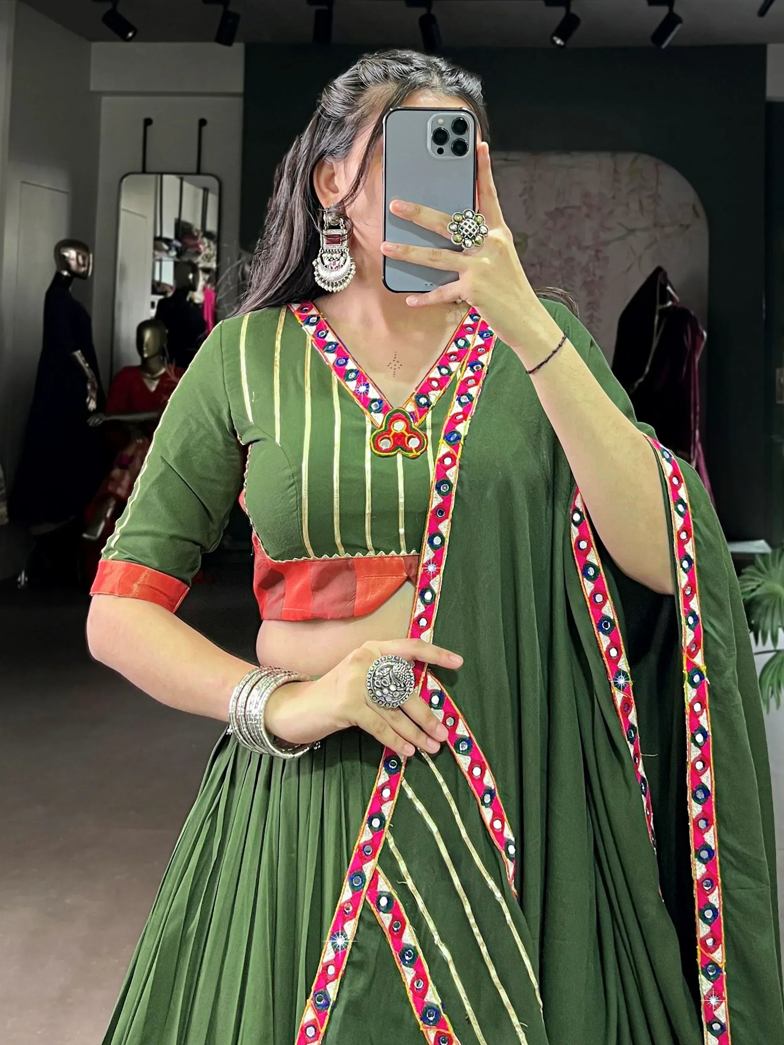 Green embroidered lehenga choli with mirror work, traditional Indian ethnic wear for women
