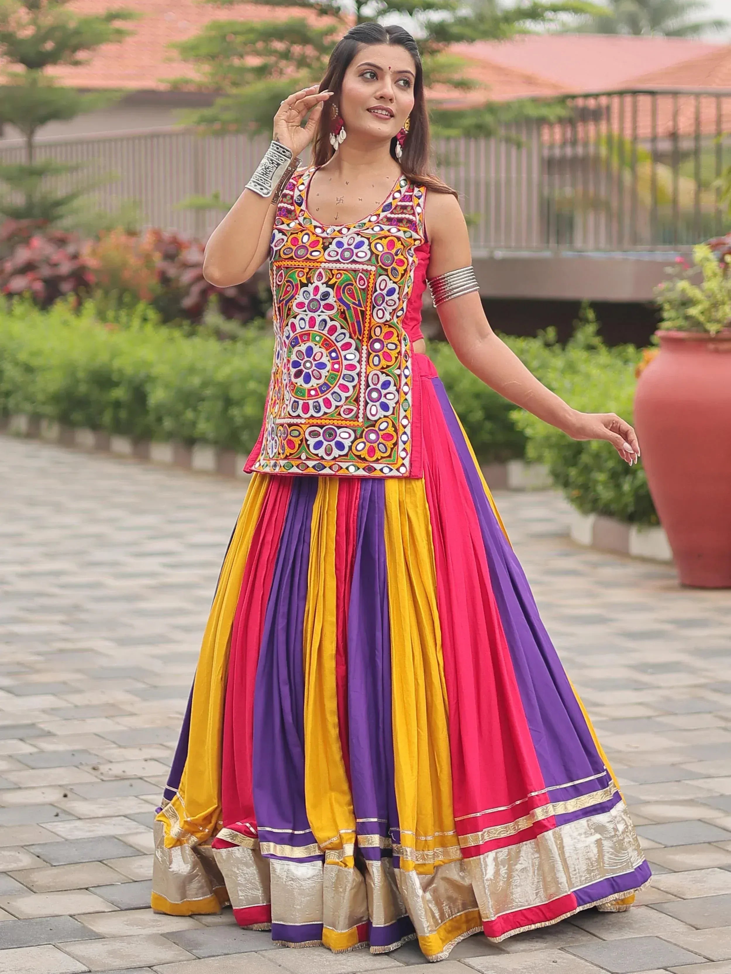 Colorful Indian ethnic wear with mirror work top and striped lehenga skirt