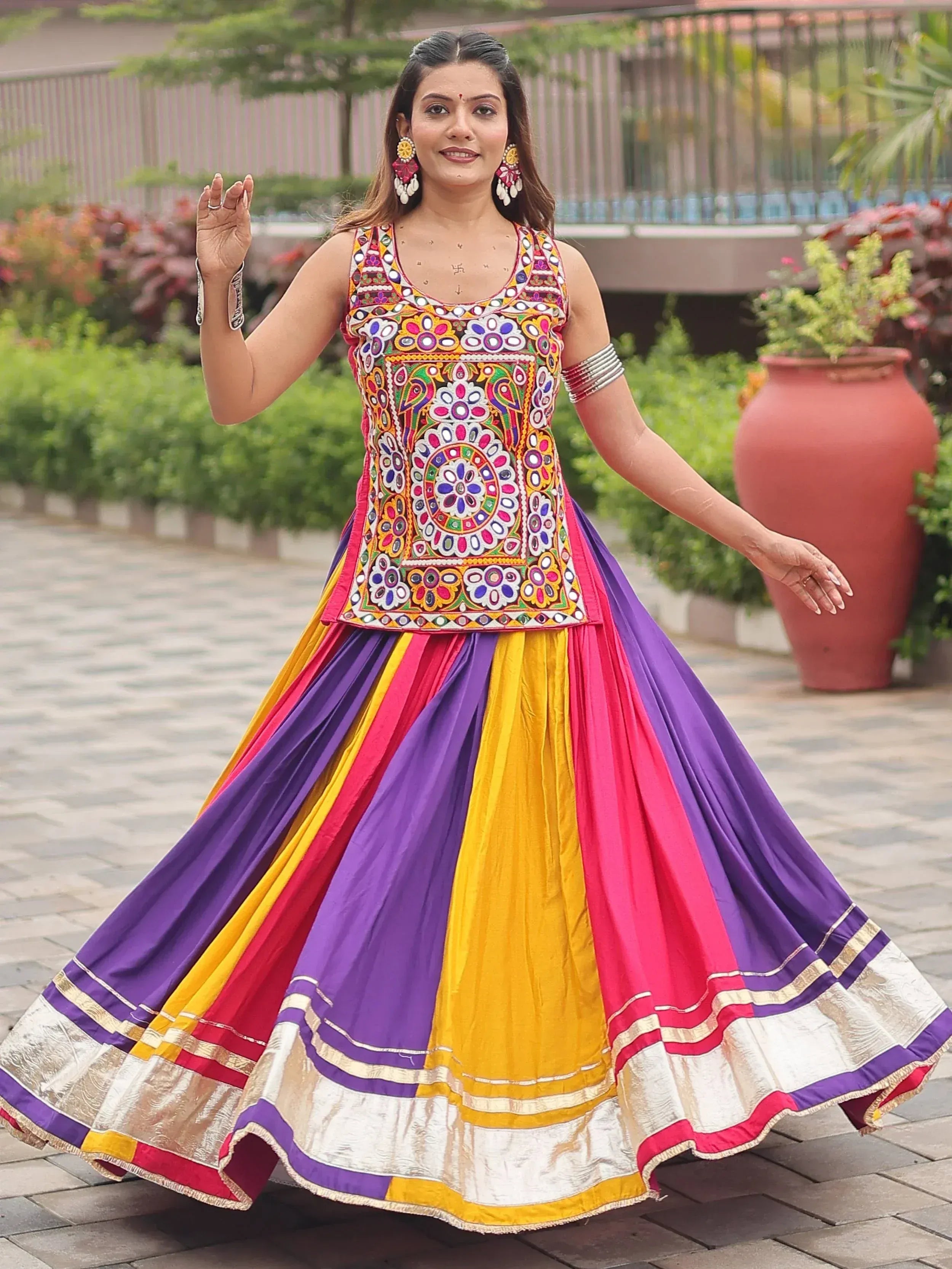 Vibrant Indian ethnic lehenga choli with colorful embroidery and pleated skirt for festive occasions