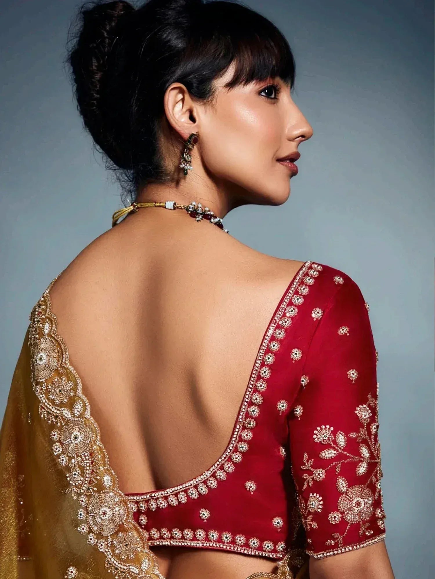 Red embroidered backless blouse with gold dupatta, ethnic Indian wear for women