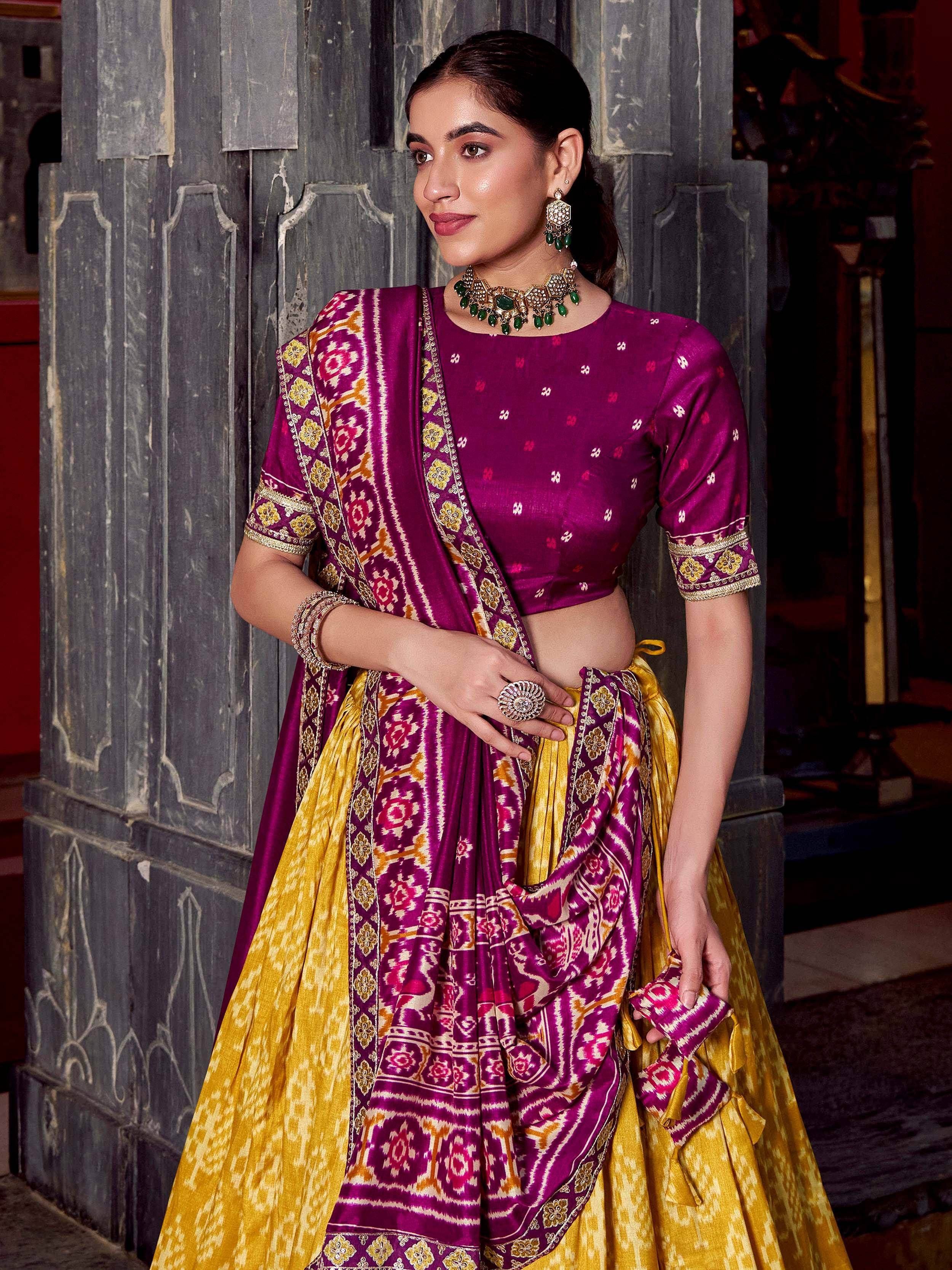 Woman in purple and gold ethnic lehenga choli with ikat print, perfect for Indian weddings and festivals