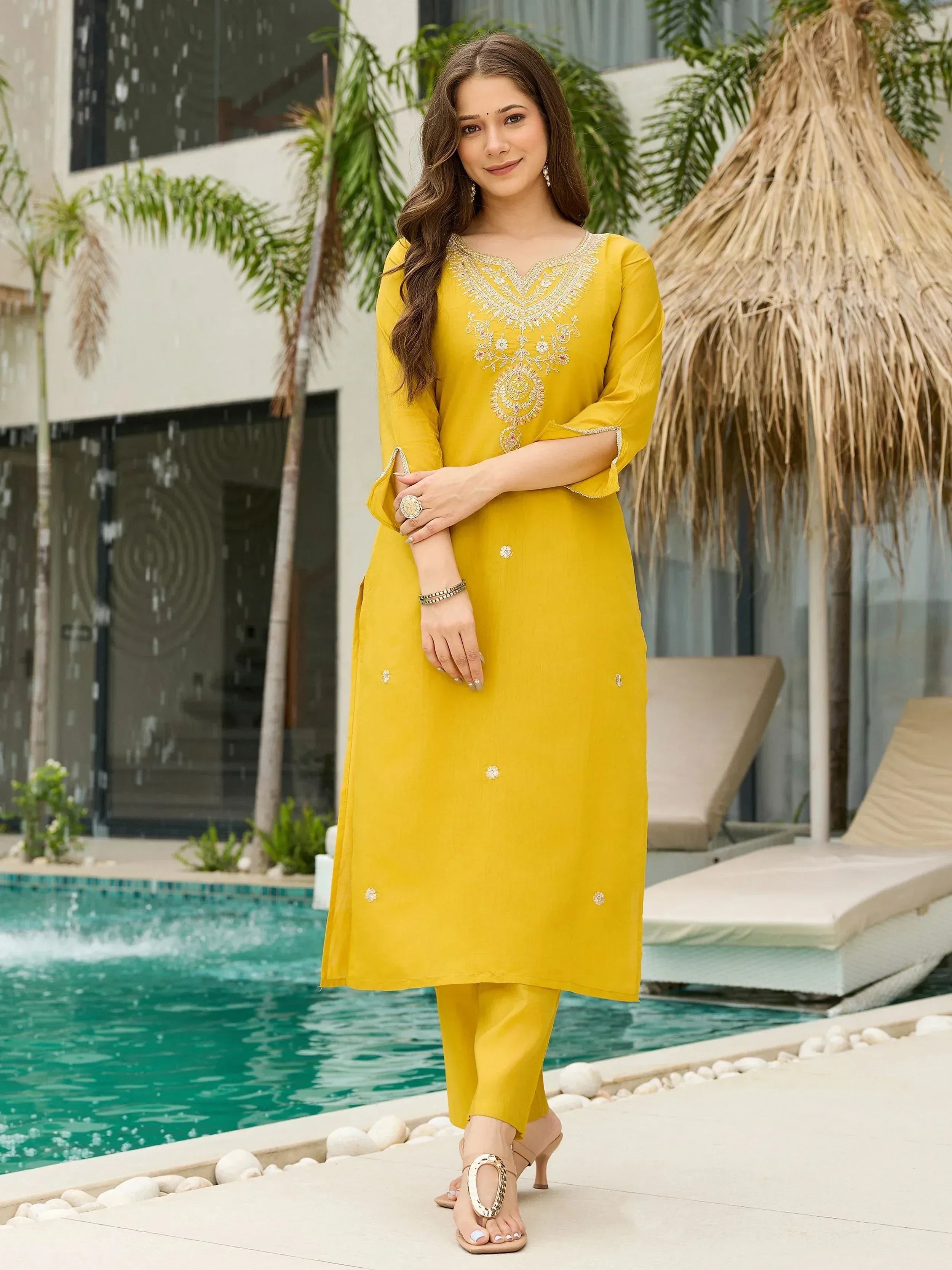 Yellow embroidered ethnic kurta set with matching pants, perfect for festive occasions and parties.
