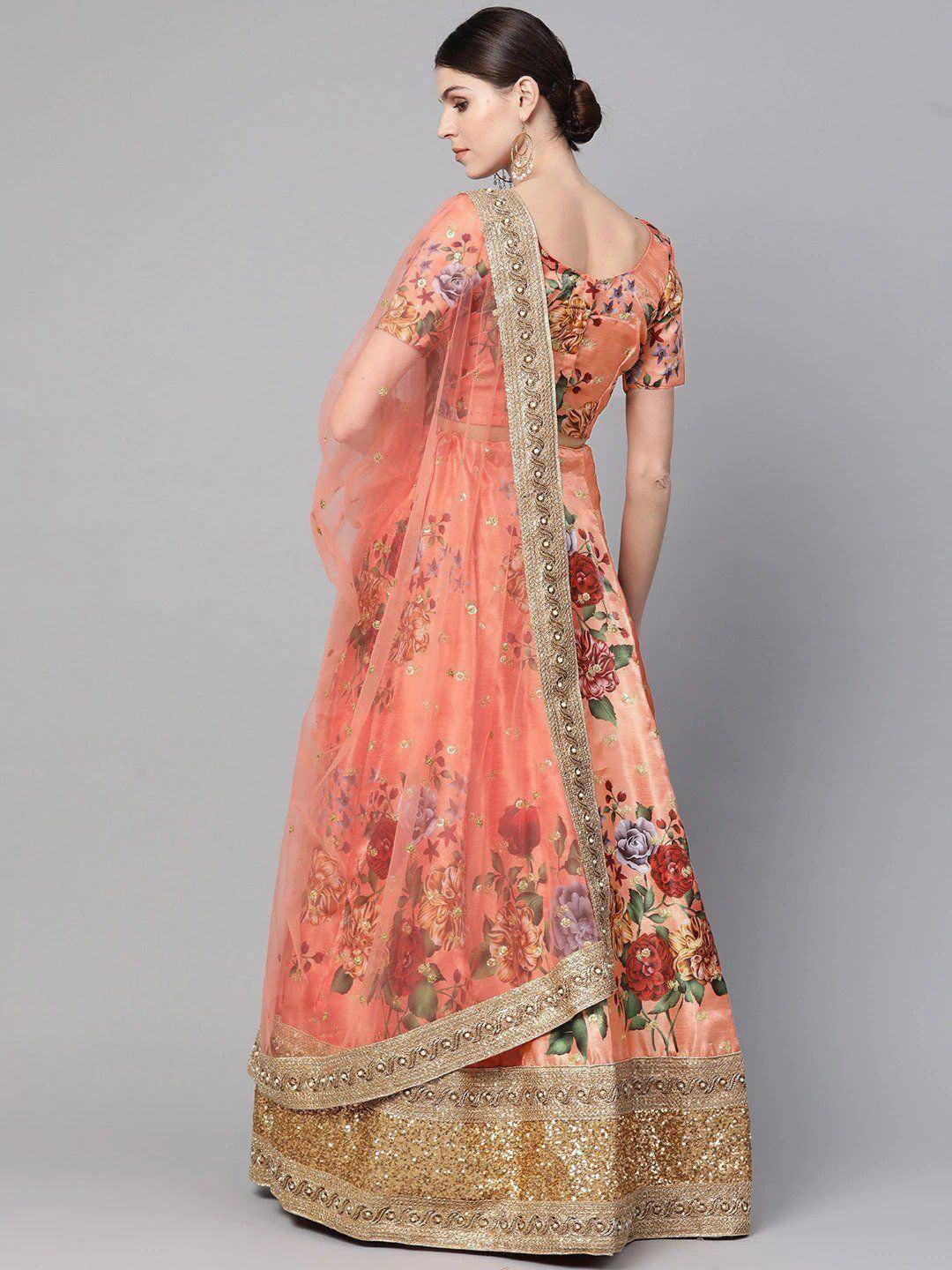 Peach floral print lehenga choli with gold embroidery and sheer dupatta, ethnic Indian wear