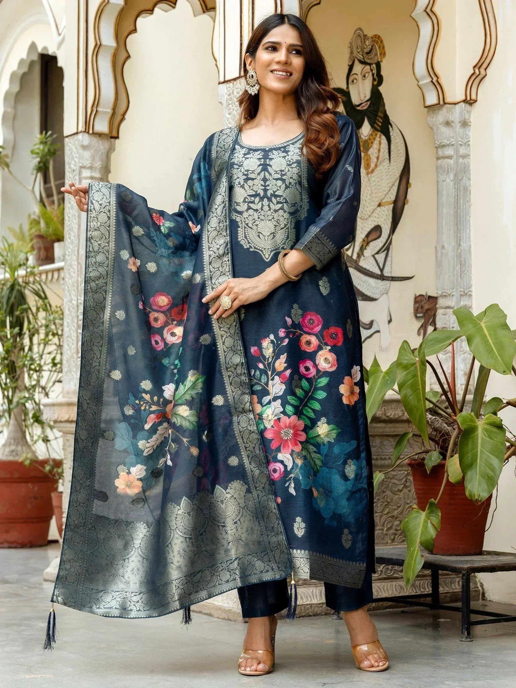 Woman in navy floral printed salwar kameez with embroidered dupatta, ethnic Indian wear