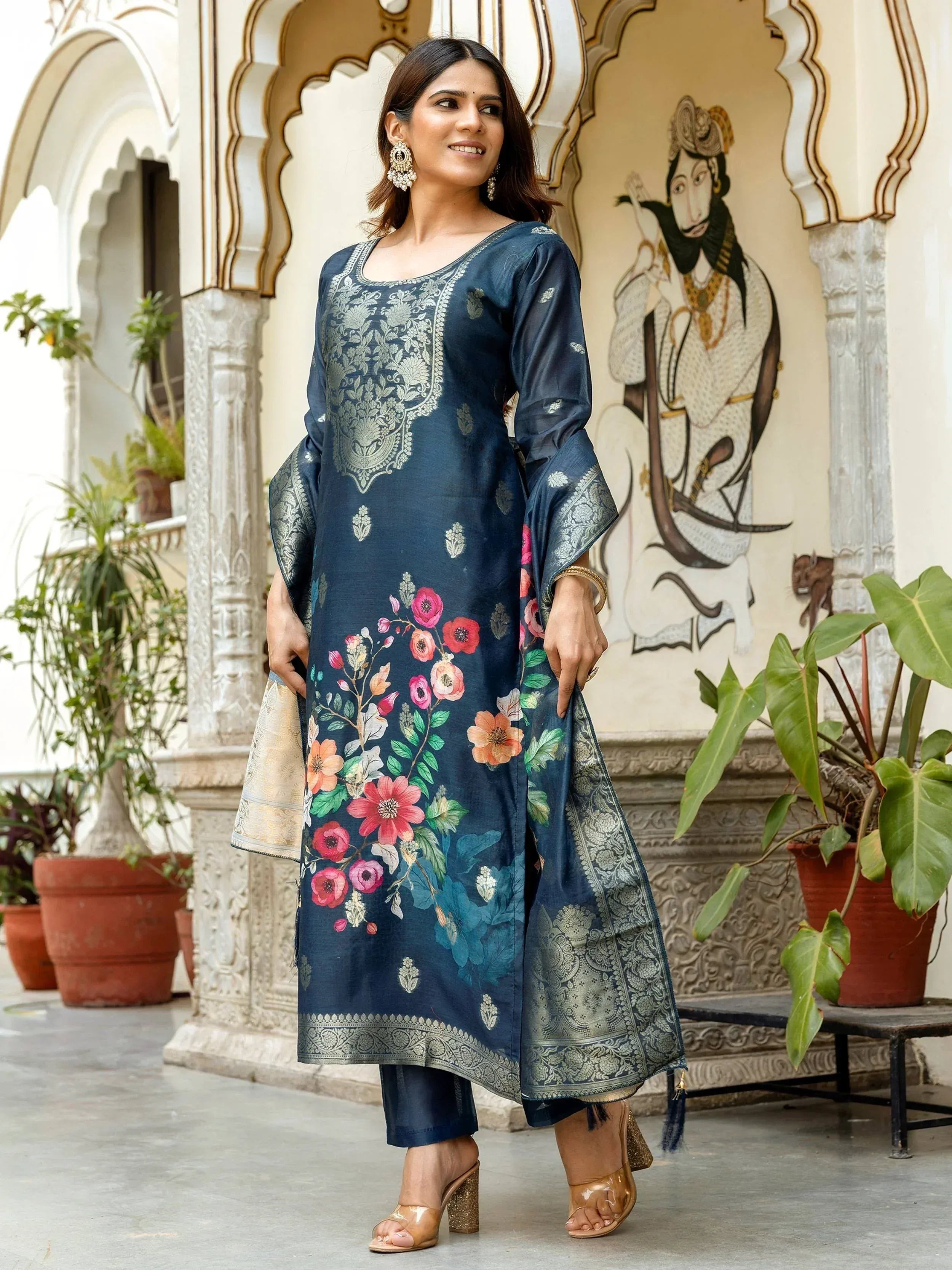 Navy blue floral printed kurta with silver embroidery, paired with matching pants and dupatta, ideal for Indian ethnic wear.