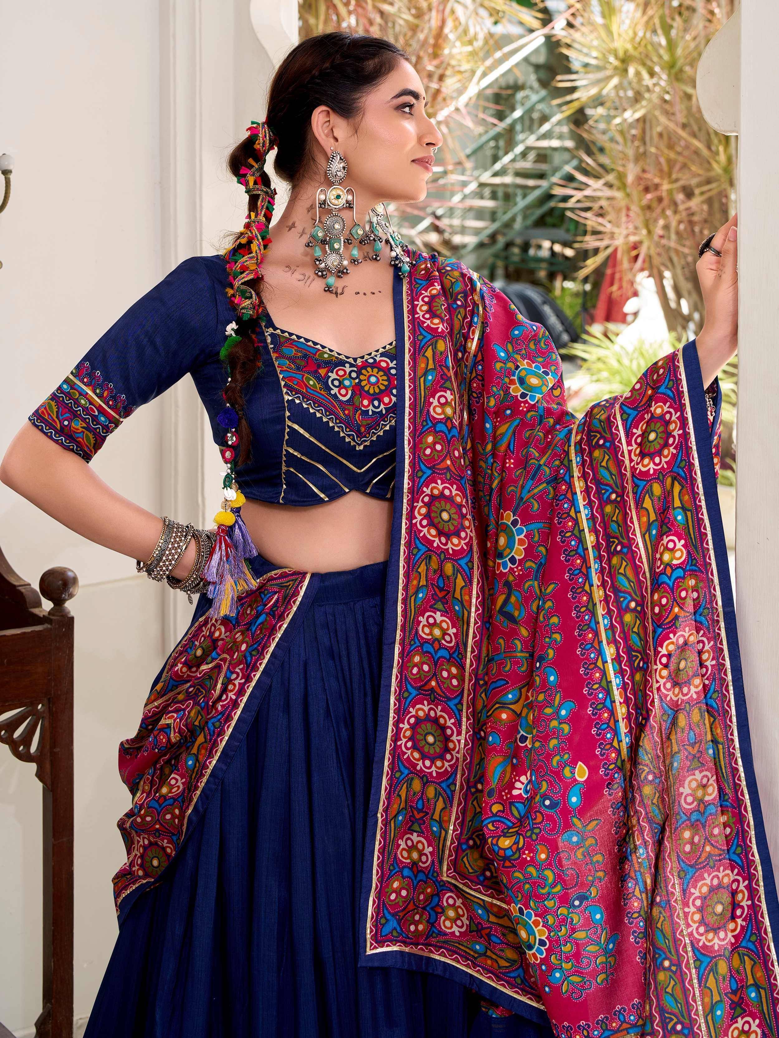 Blue embroidered lehenga choli with colorful floral dupatta, traditional Indian ethnic wear