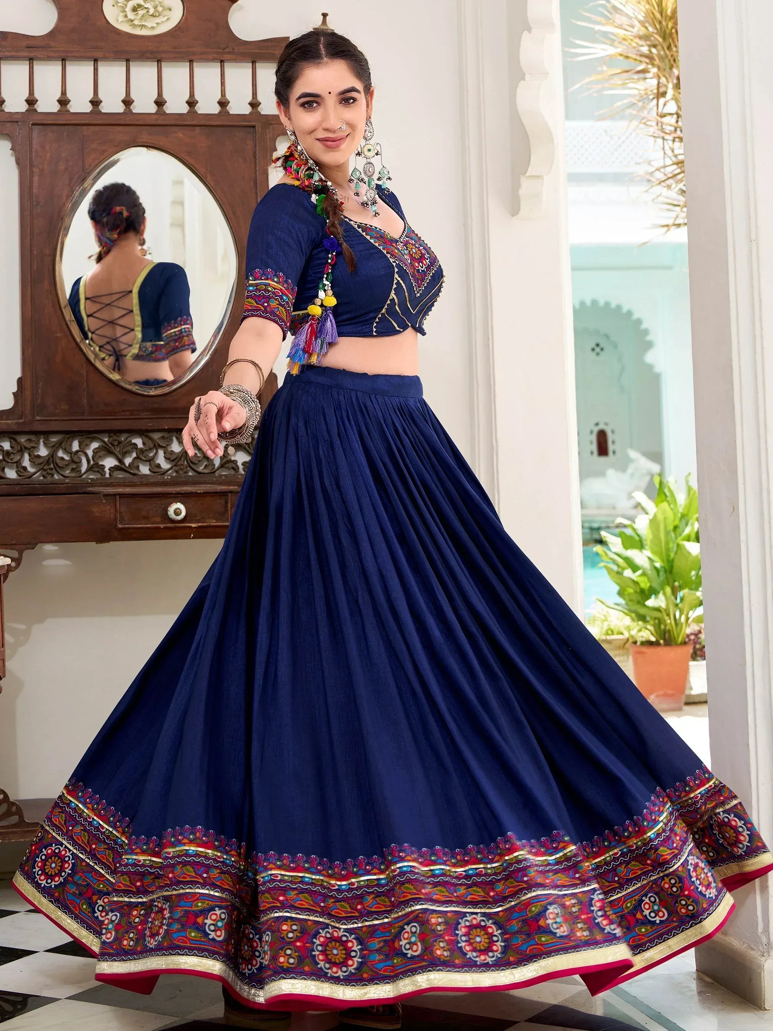Navy blue embroidered lehenga choli with colorful border, perfect for Indian ethnic wear occasions