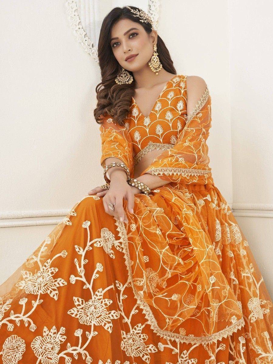 Orange embroidered lehenga choli with floral design, perfect for Indian ethnic wear occasions