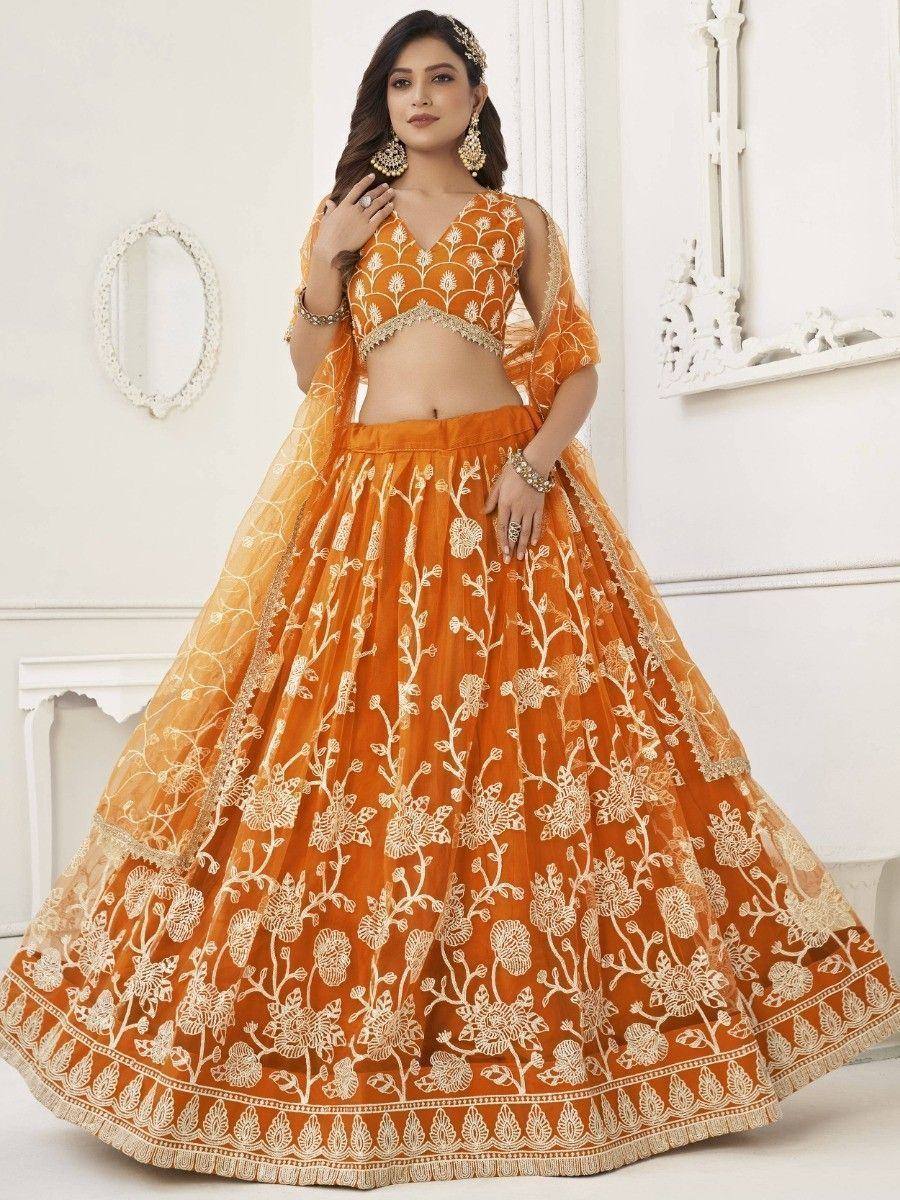 Orange embroidered lehenga choli with floral design, perfect for Indian weddings and festive occasions.
