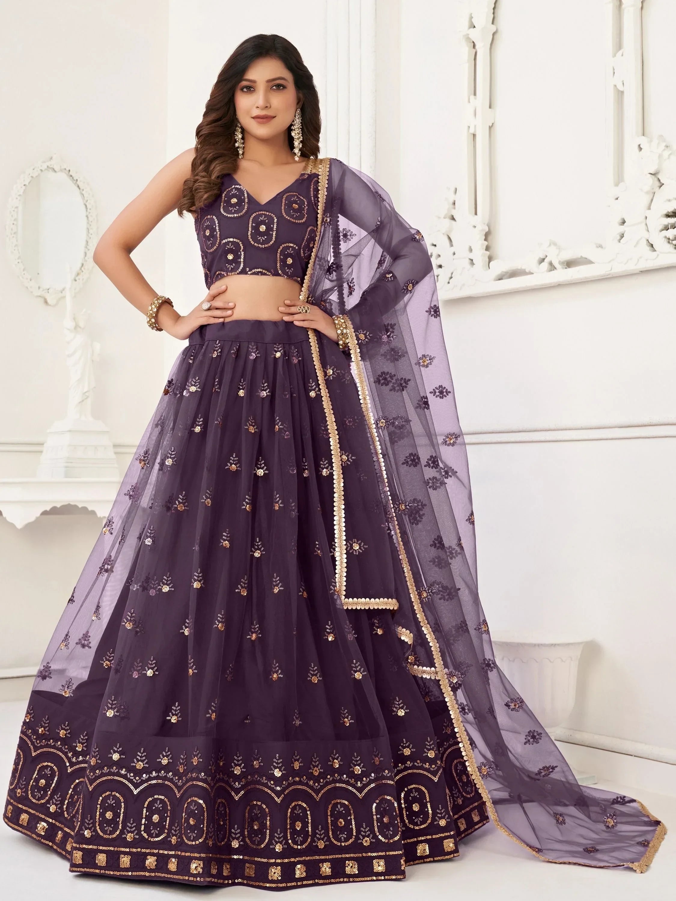 Purple embroidered lehenga choli with gold detailing and sheer dupatta, ideal for Indian ethnic wear occasions