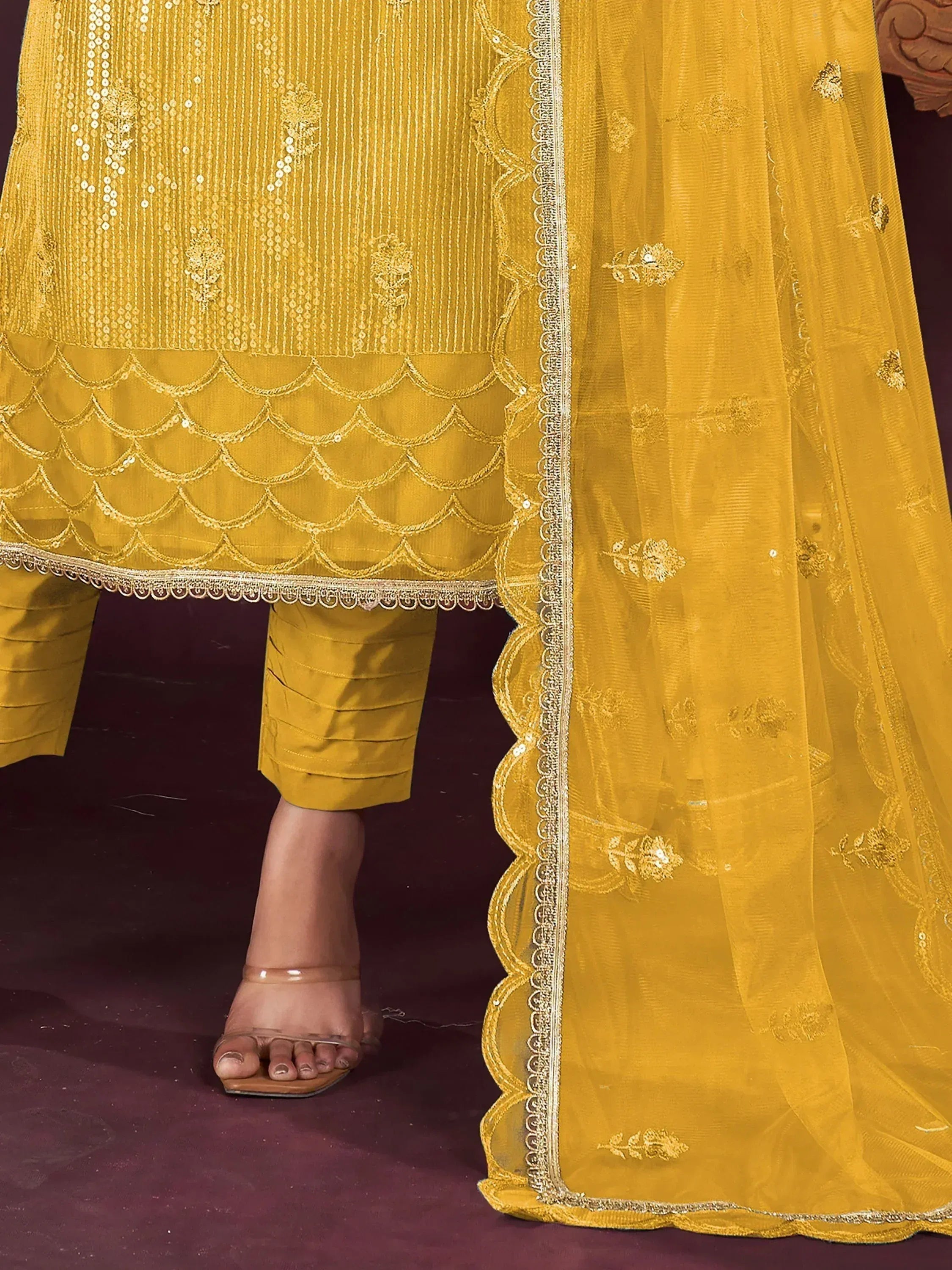 Yellow ethnic salwar kameez with scalloped hem and floral embroidery