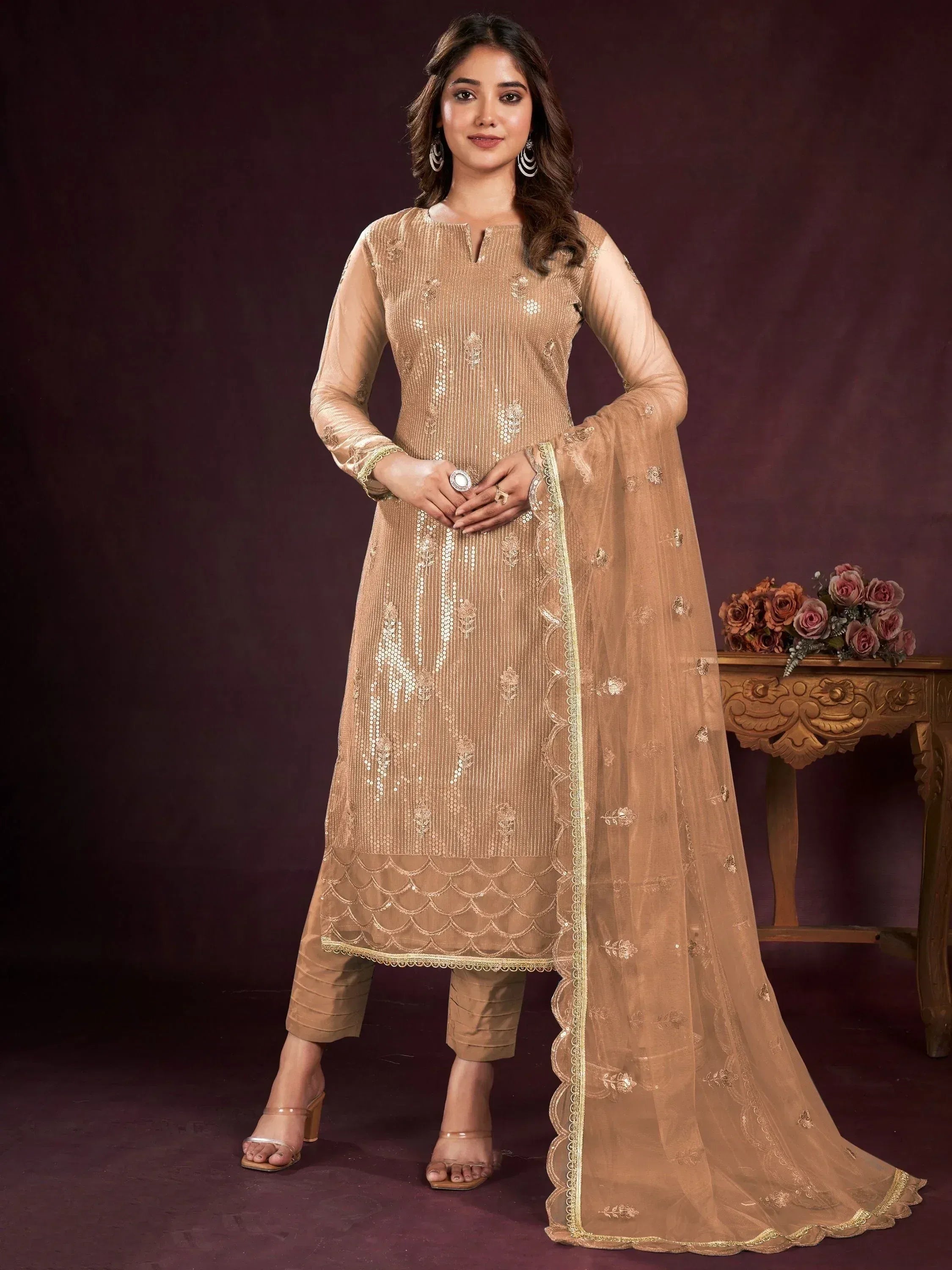 Elegant beige embroidered salwar kameez with sequins and scalloped hem, paired with matching dupatta