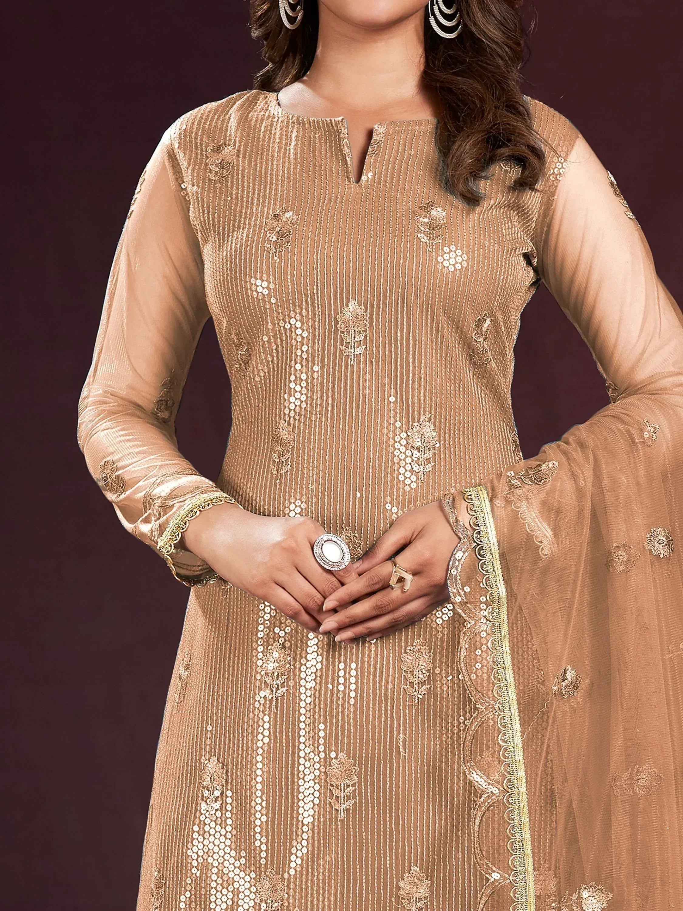 Elegant beige designer salwar kameez with sequin embroidery and sheer sleeves for festive occasions