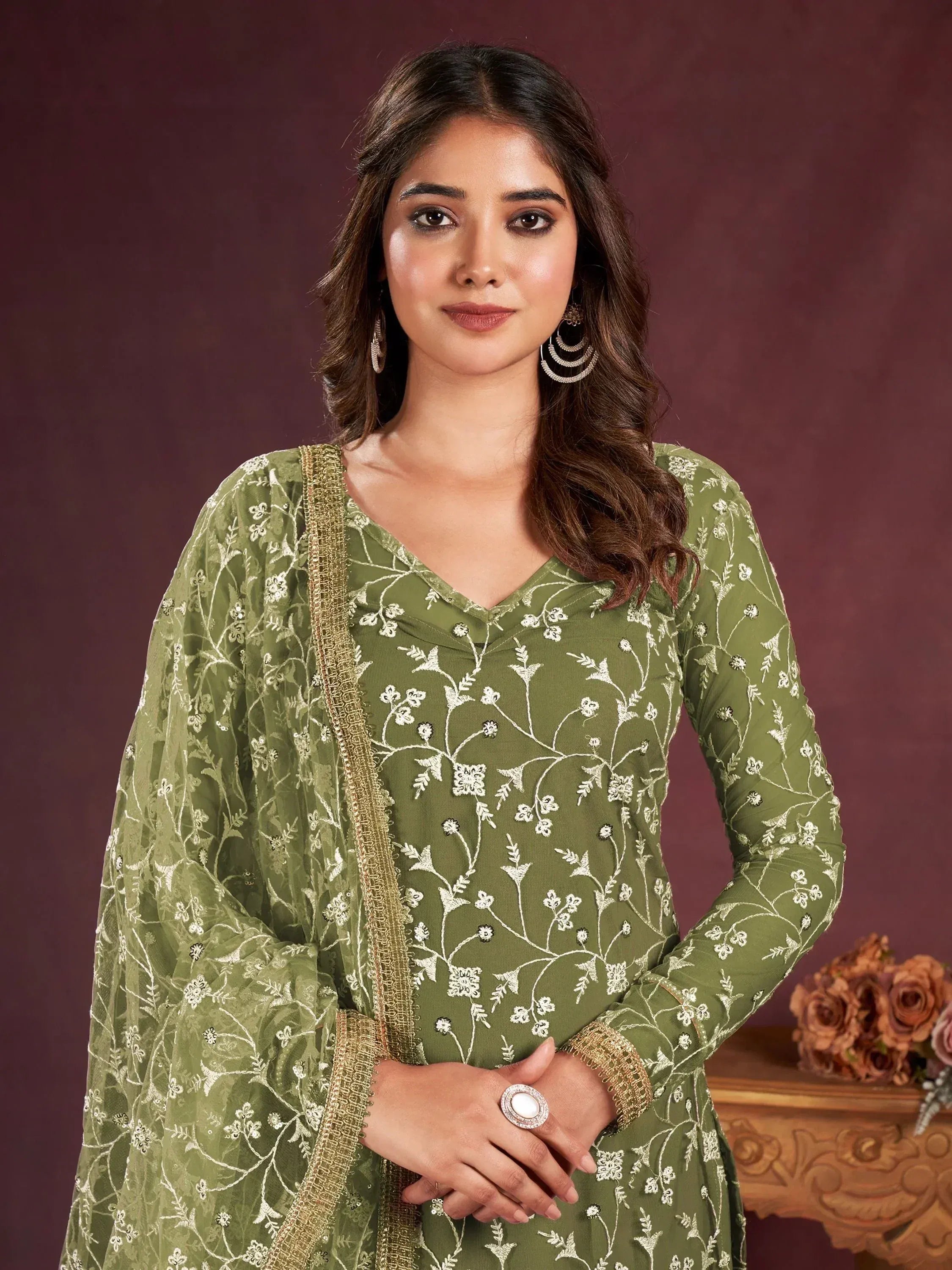 Olive green embroidered salwar kameez with floral motifs and gold trim, perfect for ethnic occasions