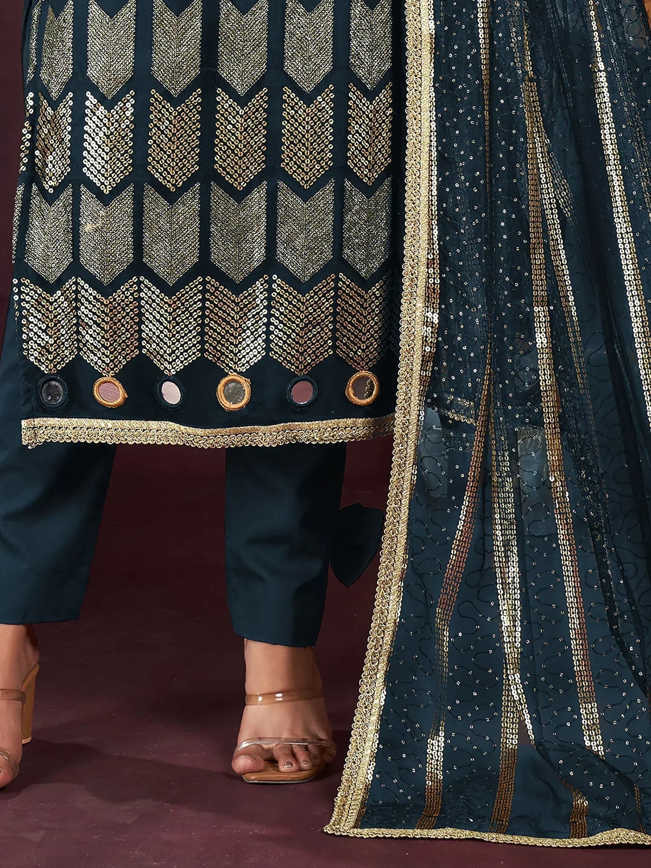 Elegant dark green salwar kameez with gold chevron embroidery and sequin dupatta