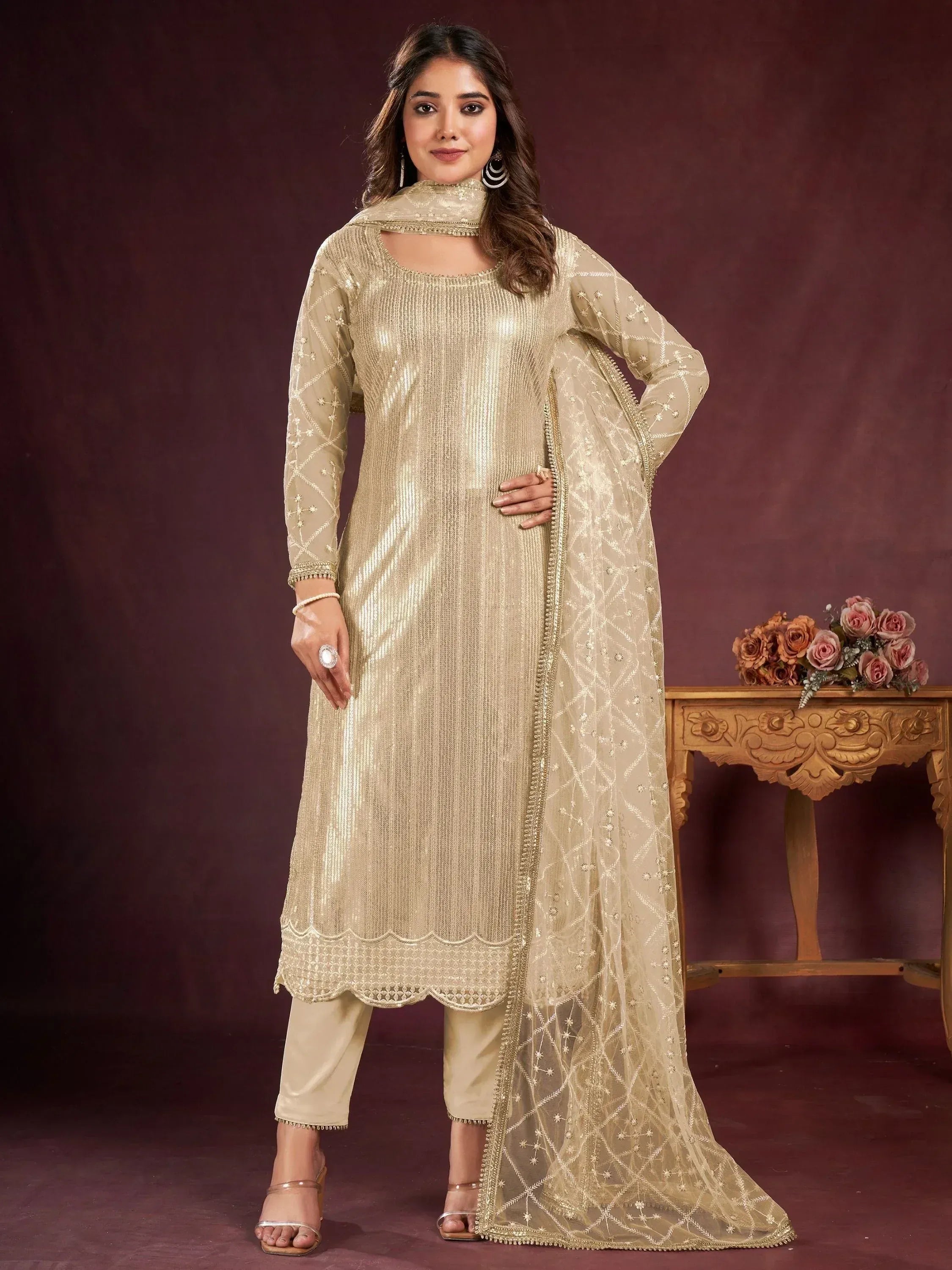 Elegant gold sequin salwar kameez with embroidered dupatta, perfect for Indian ethnic occasions