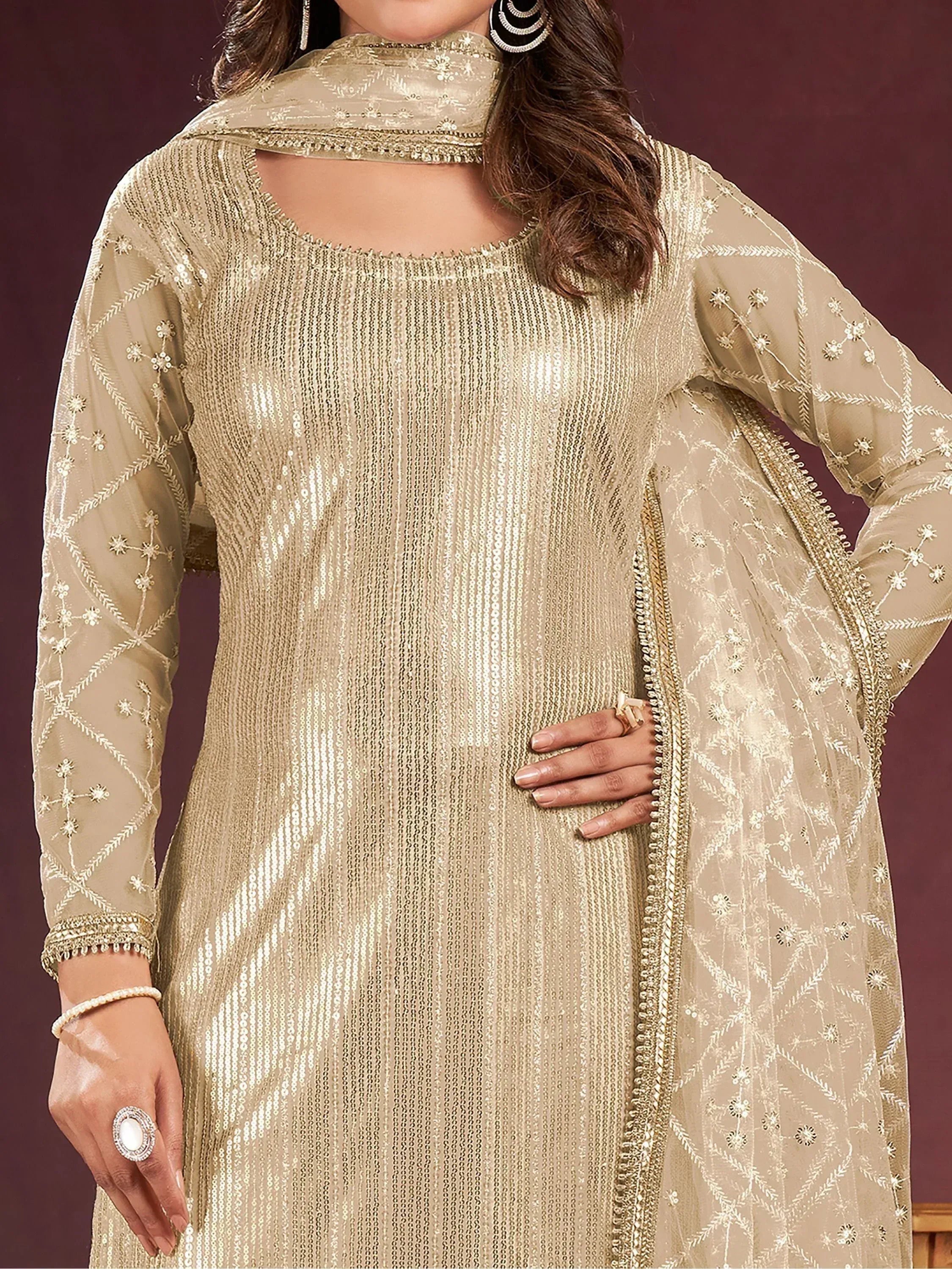 Elegant gold sequin ethnic kurti with embroidered sheer sleeves and dupatta, perfect for festive occasions.