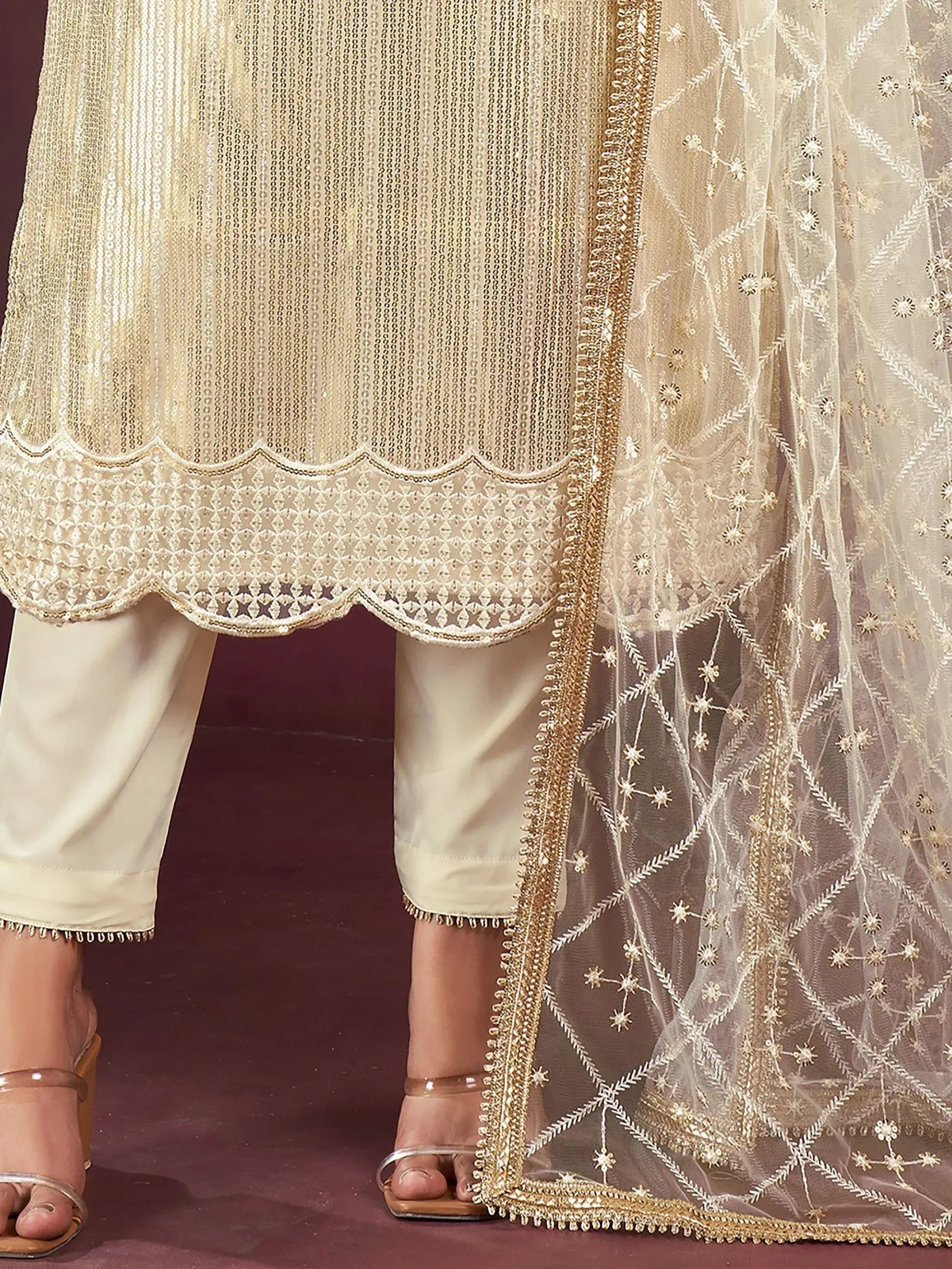 Elegant cream ethnic salwar kameez with scalloped hem and embroidered dupatta
