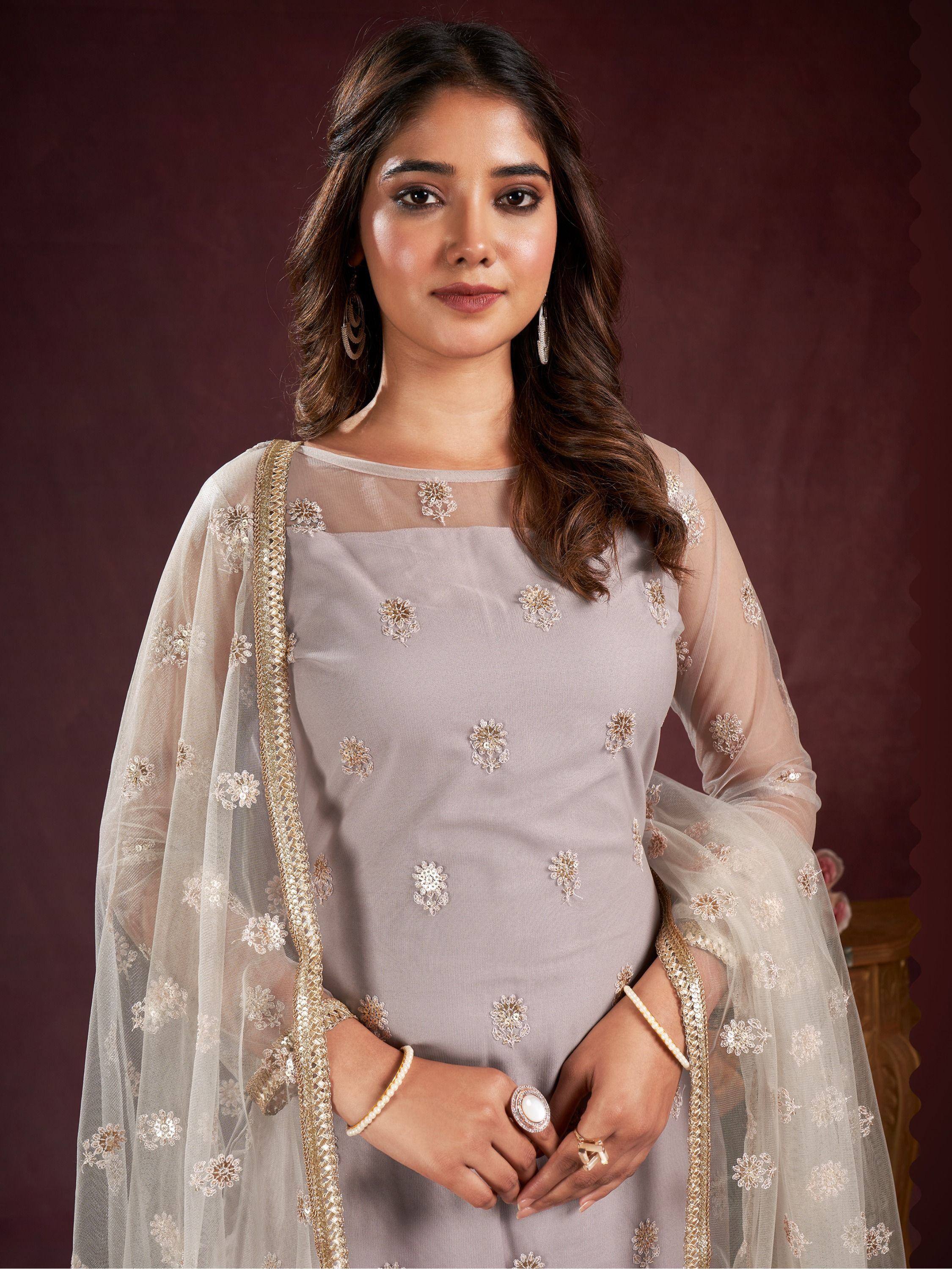 Elegant grey embroidered salwar kameez with sheer floral dupatta, perfect for Indian ethnic wear occasions.