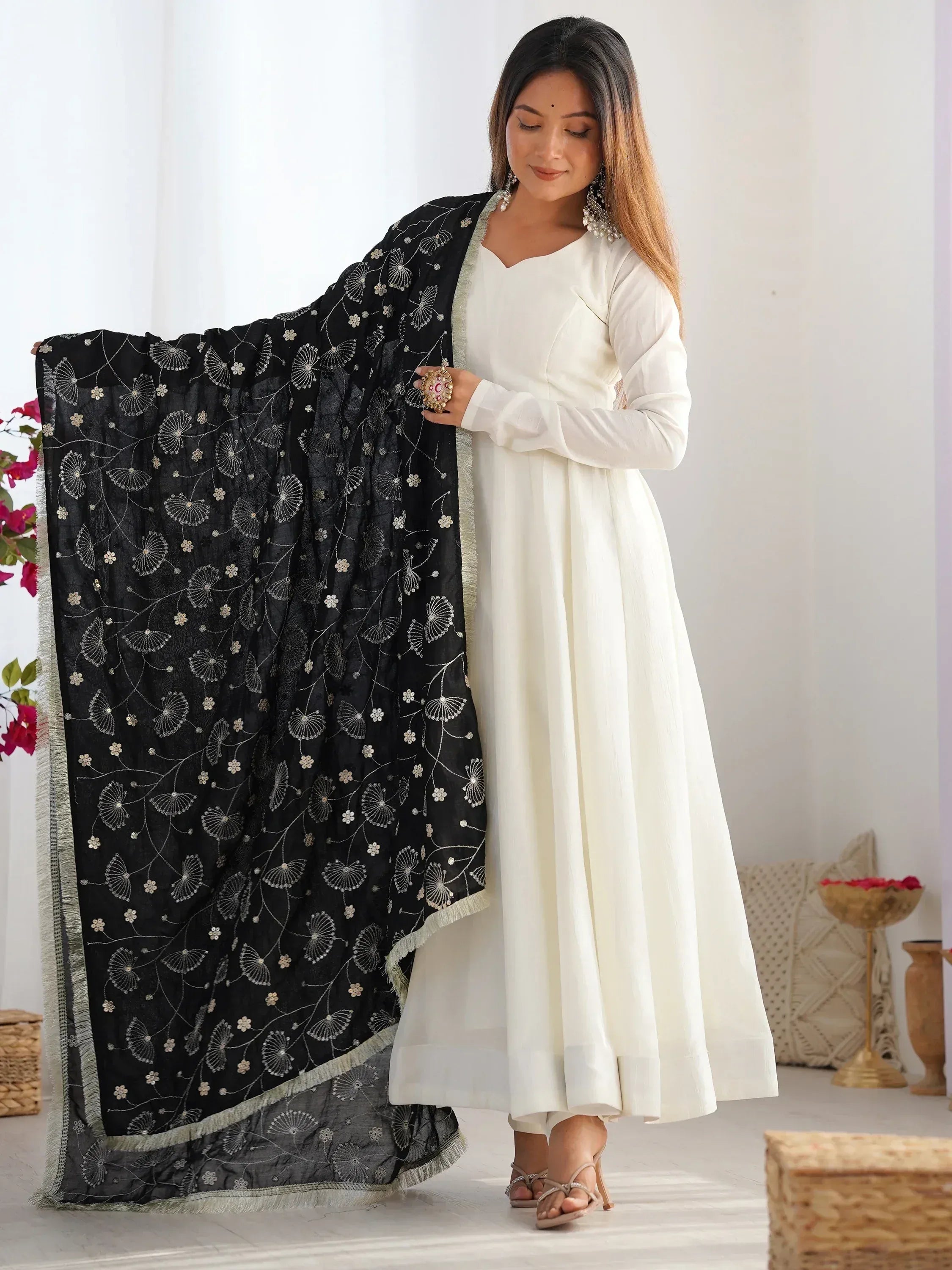 Elegant white ethnic gown with black embroidered dupatta, perfect for Indian festive occasions