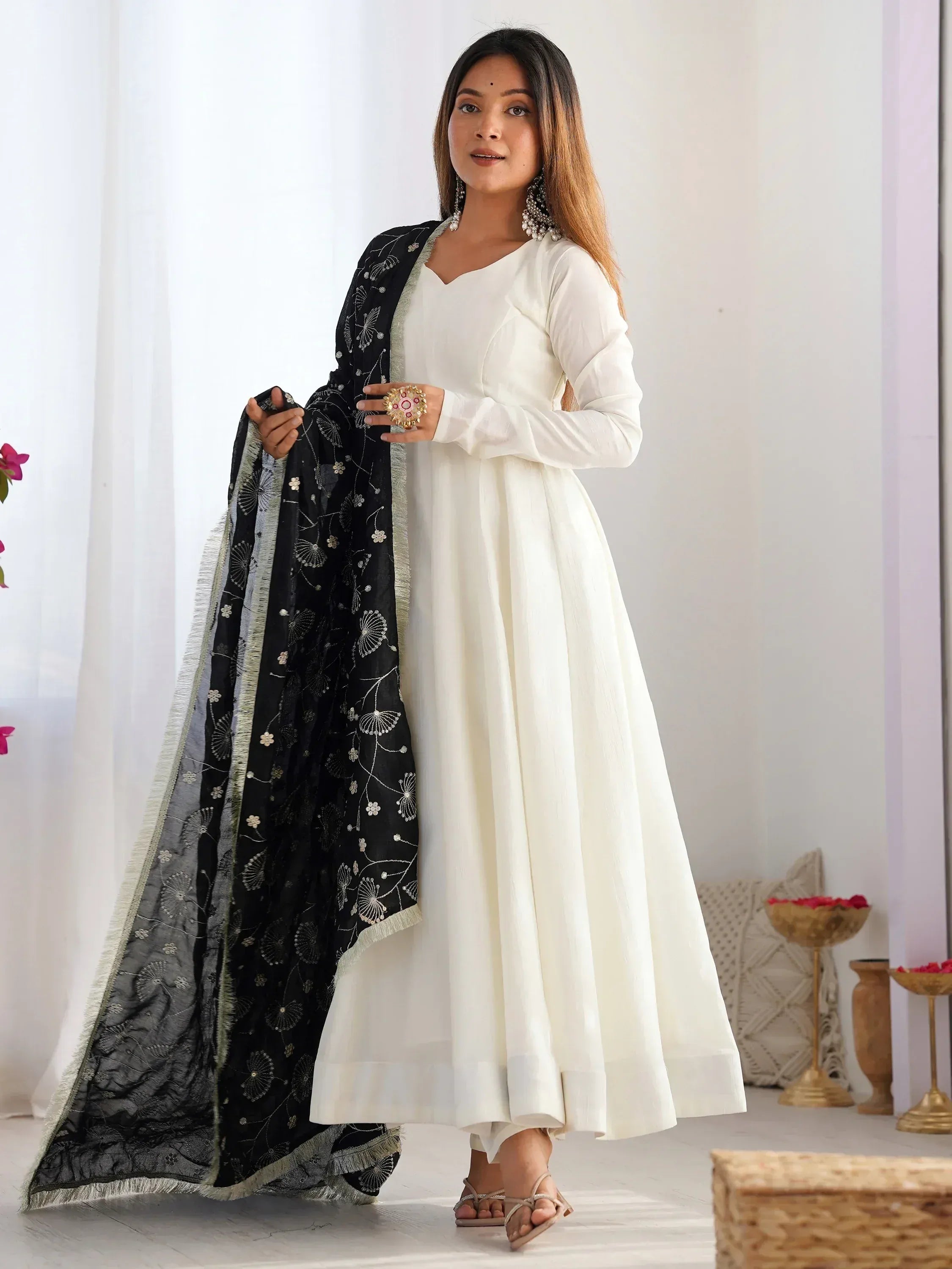 Elegant white ethnic gown with black embroidered dupatta, perfect for Indian festive occasions