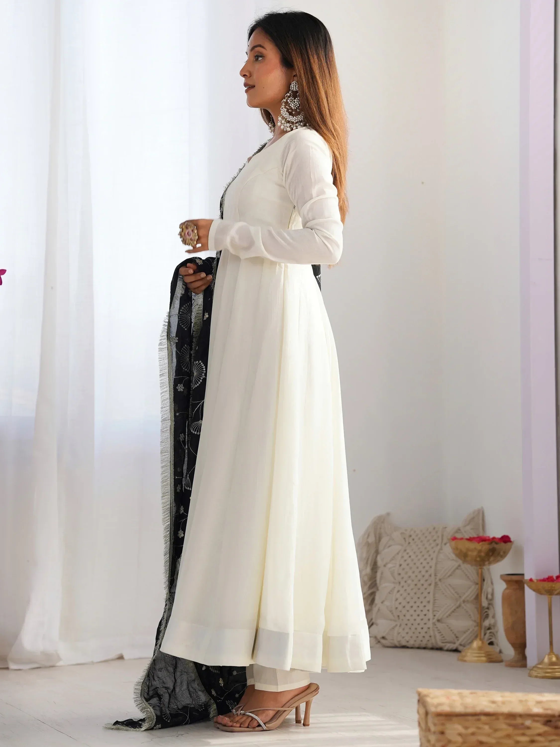 White ethnic anarkali suit with black embroidered dupatta, perfect for Indian festive occasions