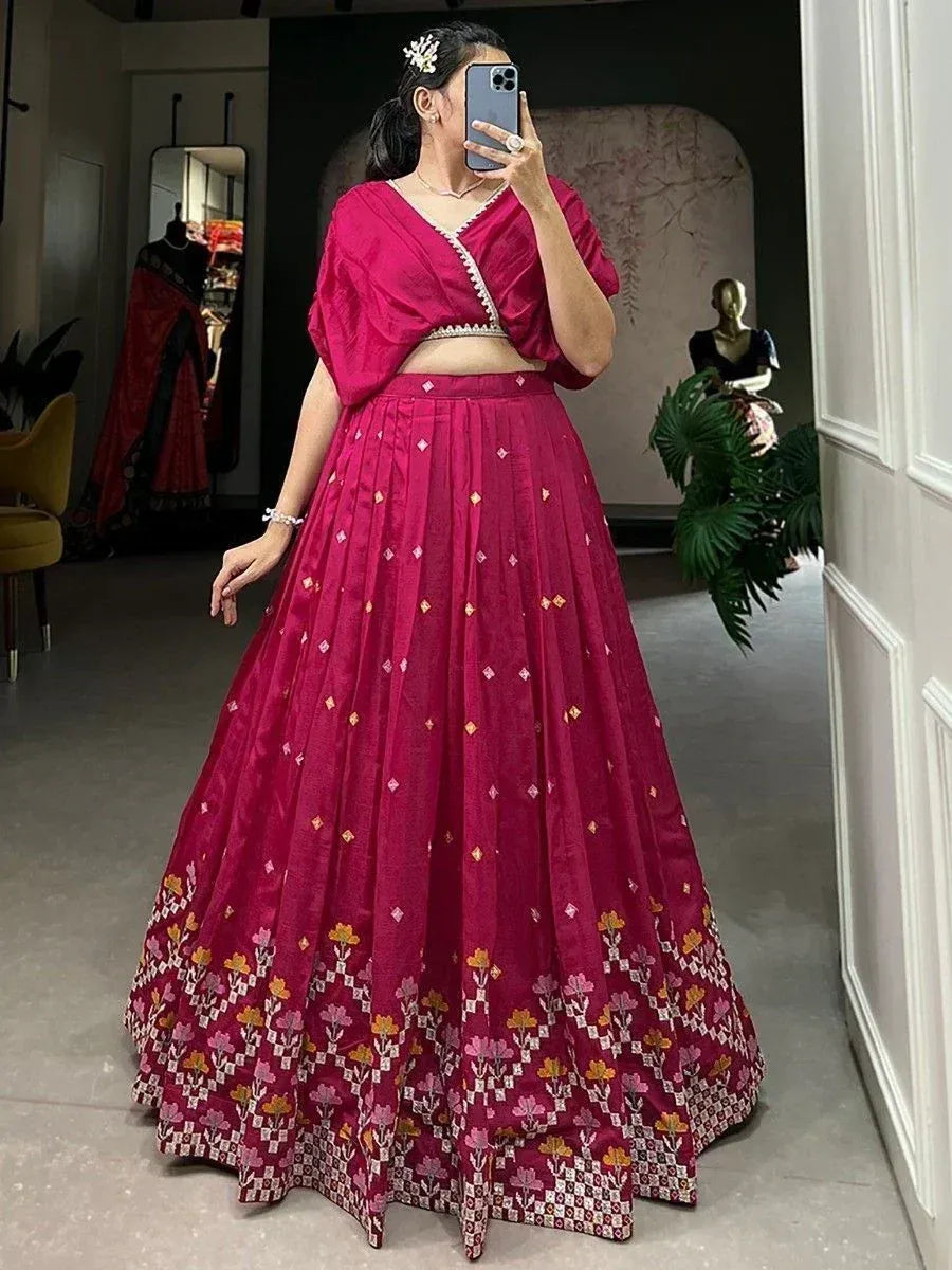 Pink embroidered lehenga choli with floral border, perfect for Indian ethnic occasions