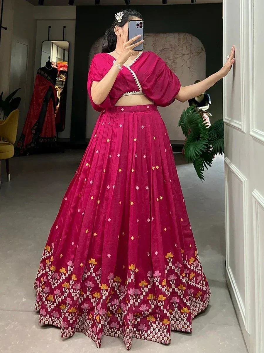 Fuchsia lehenga choli with floral embroidery, perfect for Indian ethnic wear and festive occasions