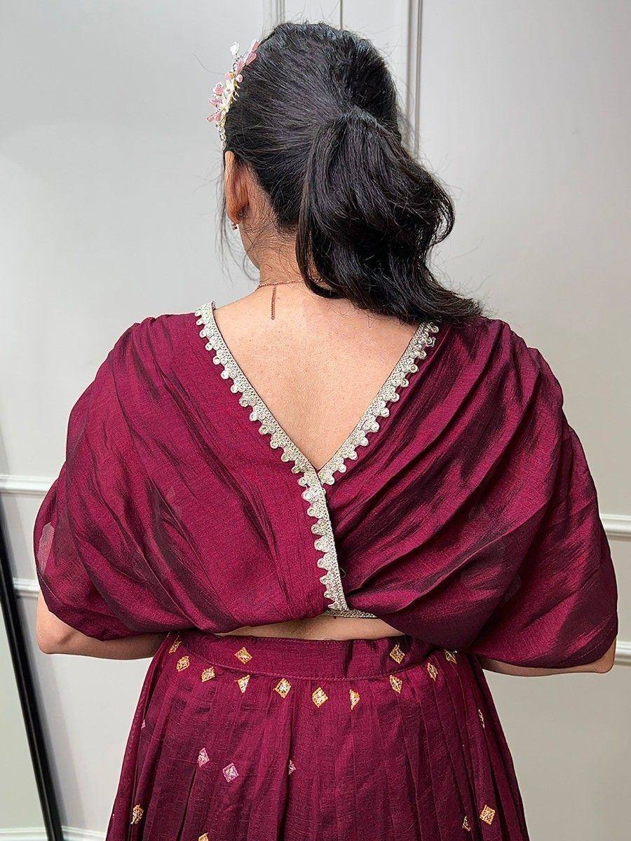 Maroon ethnic lehenga choli with V-back blouse and gold embroidery, perfect for Indian weddings and festivals