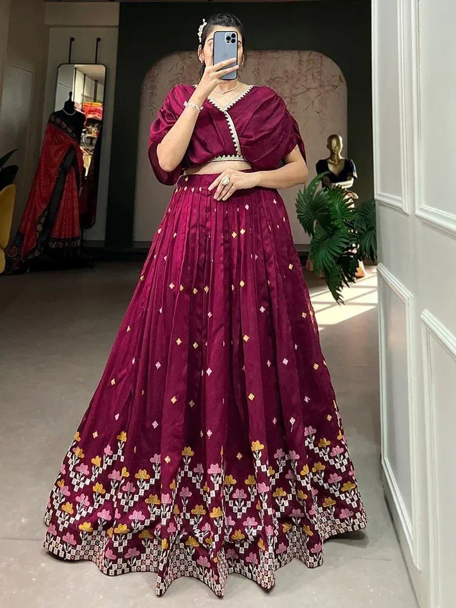 Maroon lehenga choli with floral embroidery, perfect for Indian ethnic wear and festive occasions.