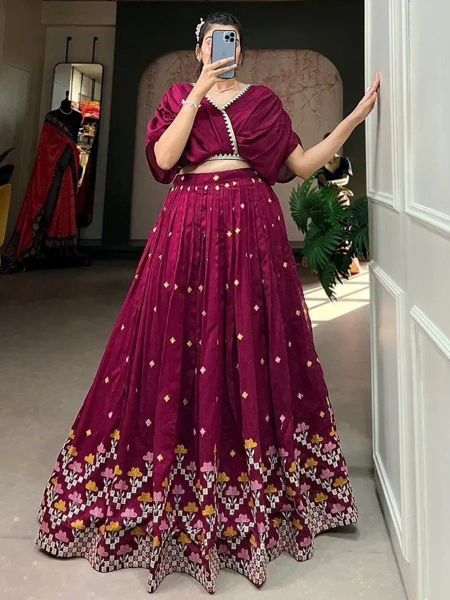 Maroon lehenga choli with floral embroidery, perfect for Indian ethnic wear and festive occasions.