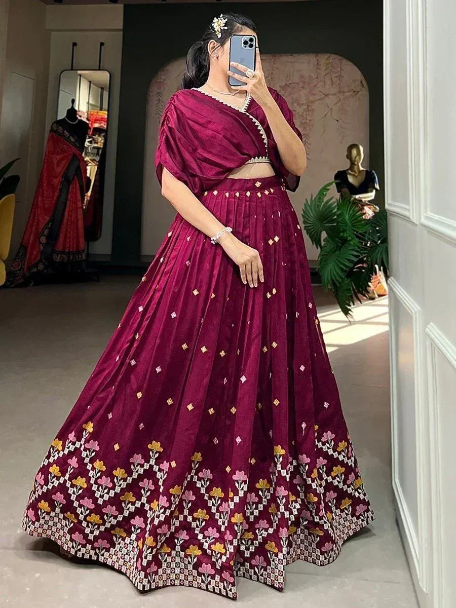 Maroon velvet lehenga choli with floral embroidery, perfect for Indian ethnic wear and festive occasions.
