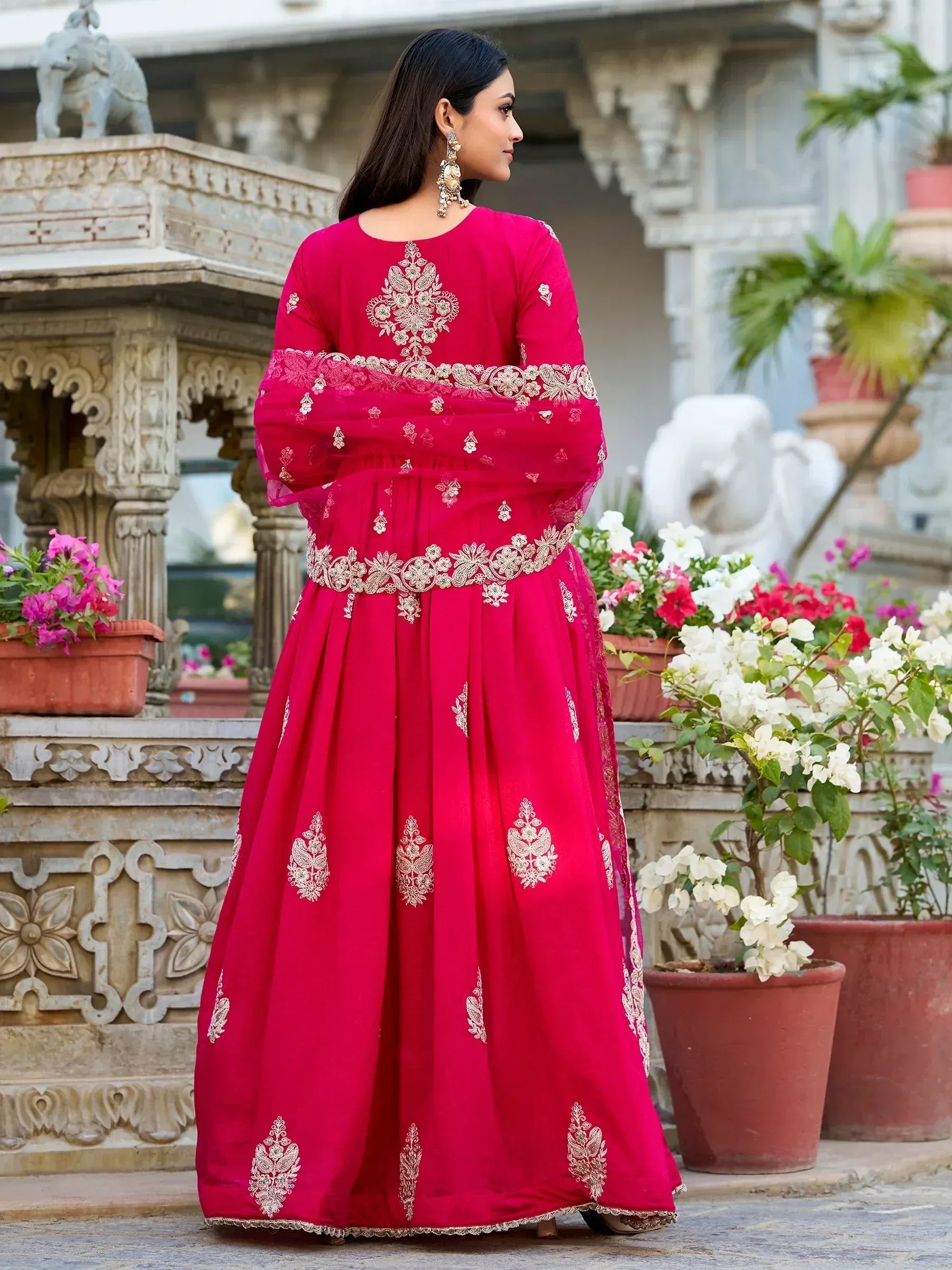 Vibrant pink anarkali with gold embroidery, perfect for Indian ethnic wear occasions