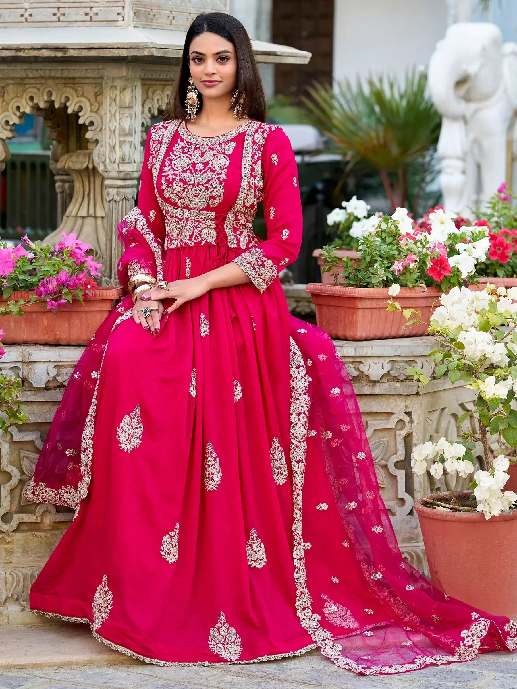 Elegant red embroidered anarkali gown with gold detailing, perfect for Indian ethnic wear occasions.