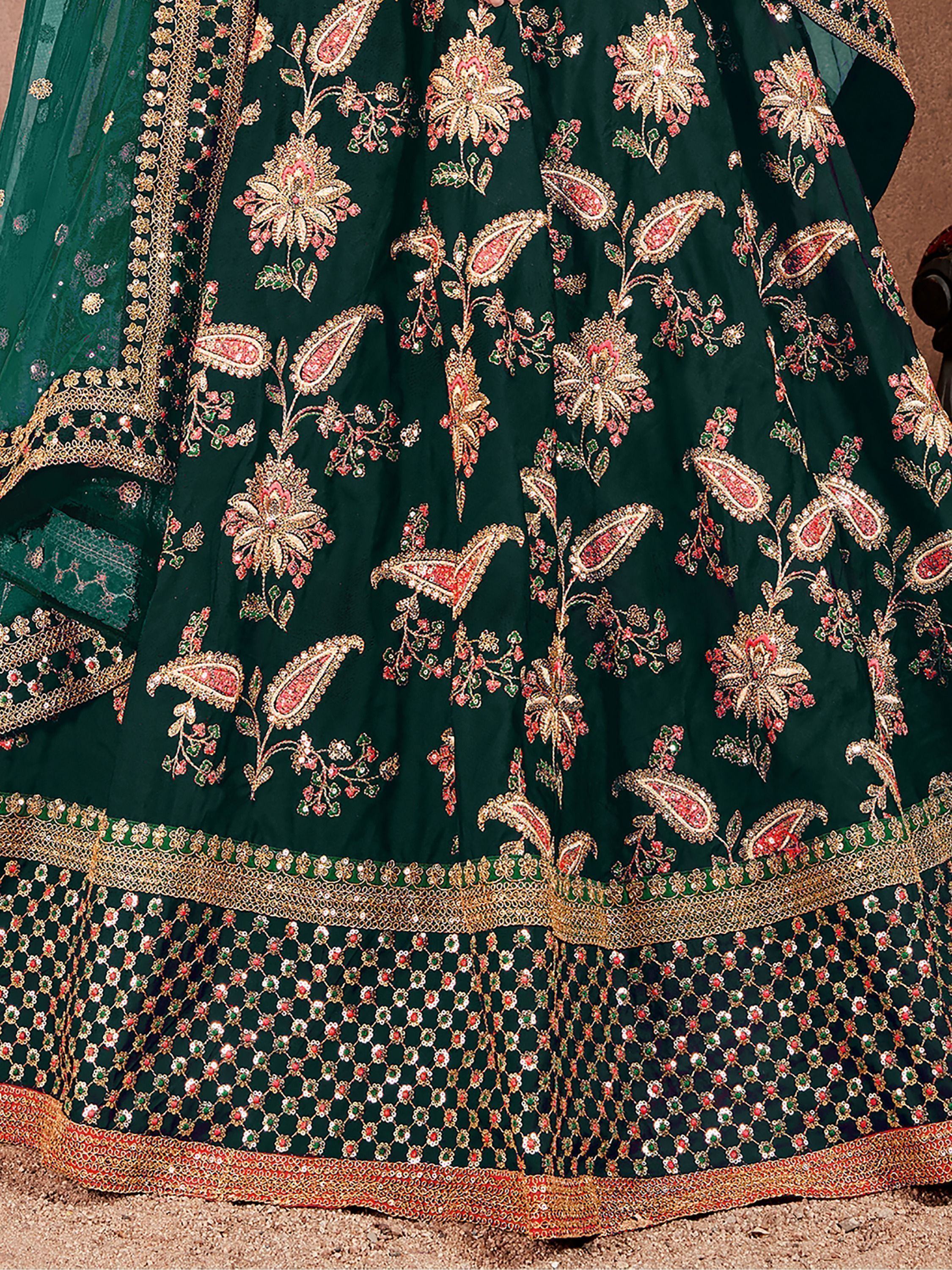 Emerald green lehenga with intricate gold, pink, and green floral embroidery and heavy border detailing