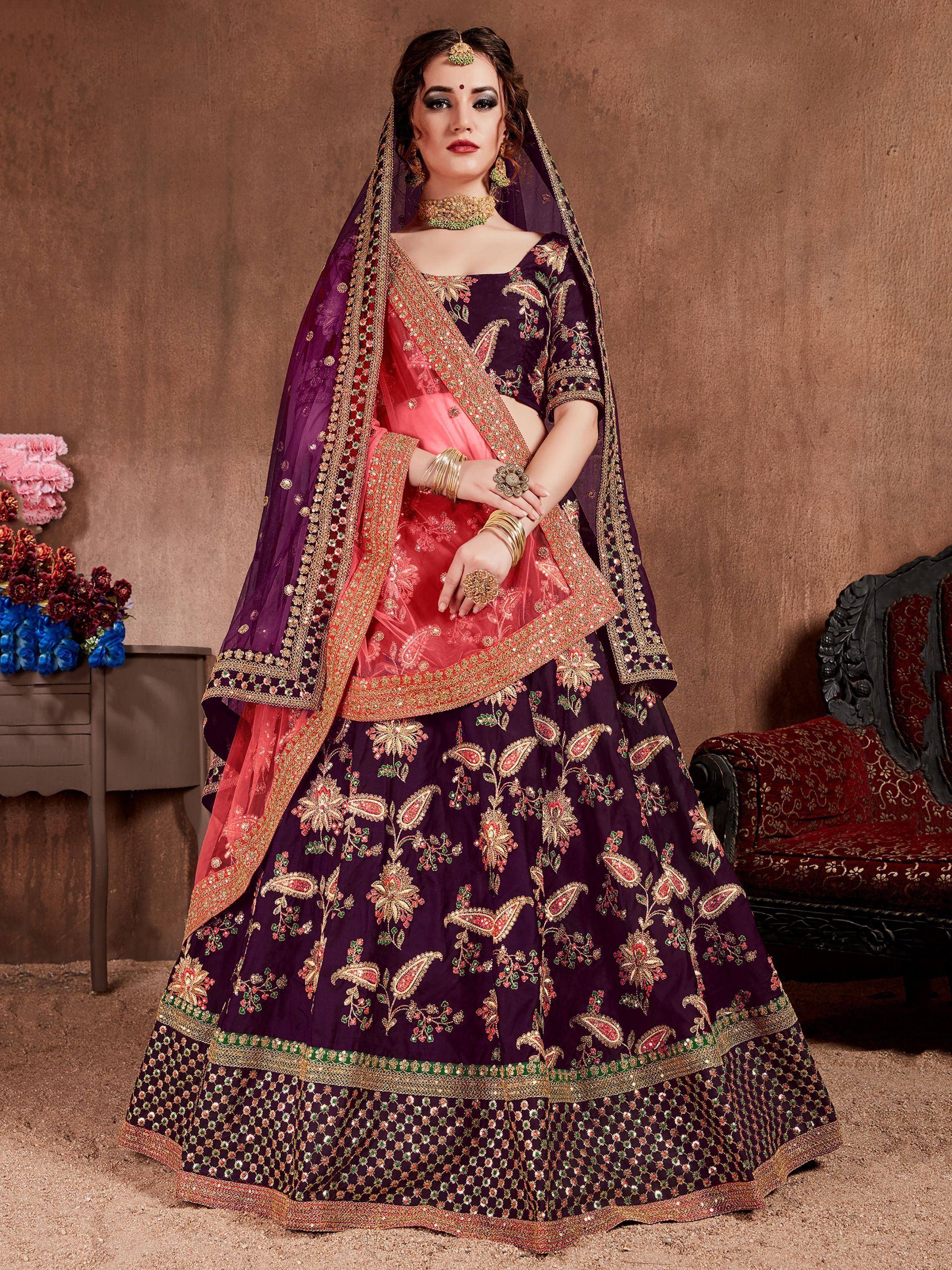Purple and pink embroidered lehenga choli with gold detailing, perfect for Indian weddings and festive occasions.